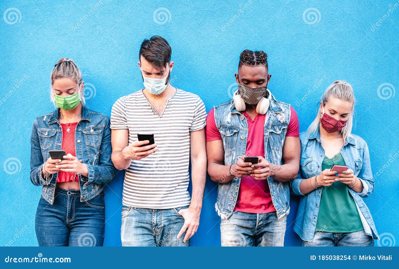 multiracial friends with face masks using tracking app with mobile smart phones - young millenial people sharing content online