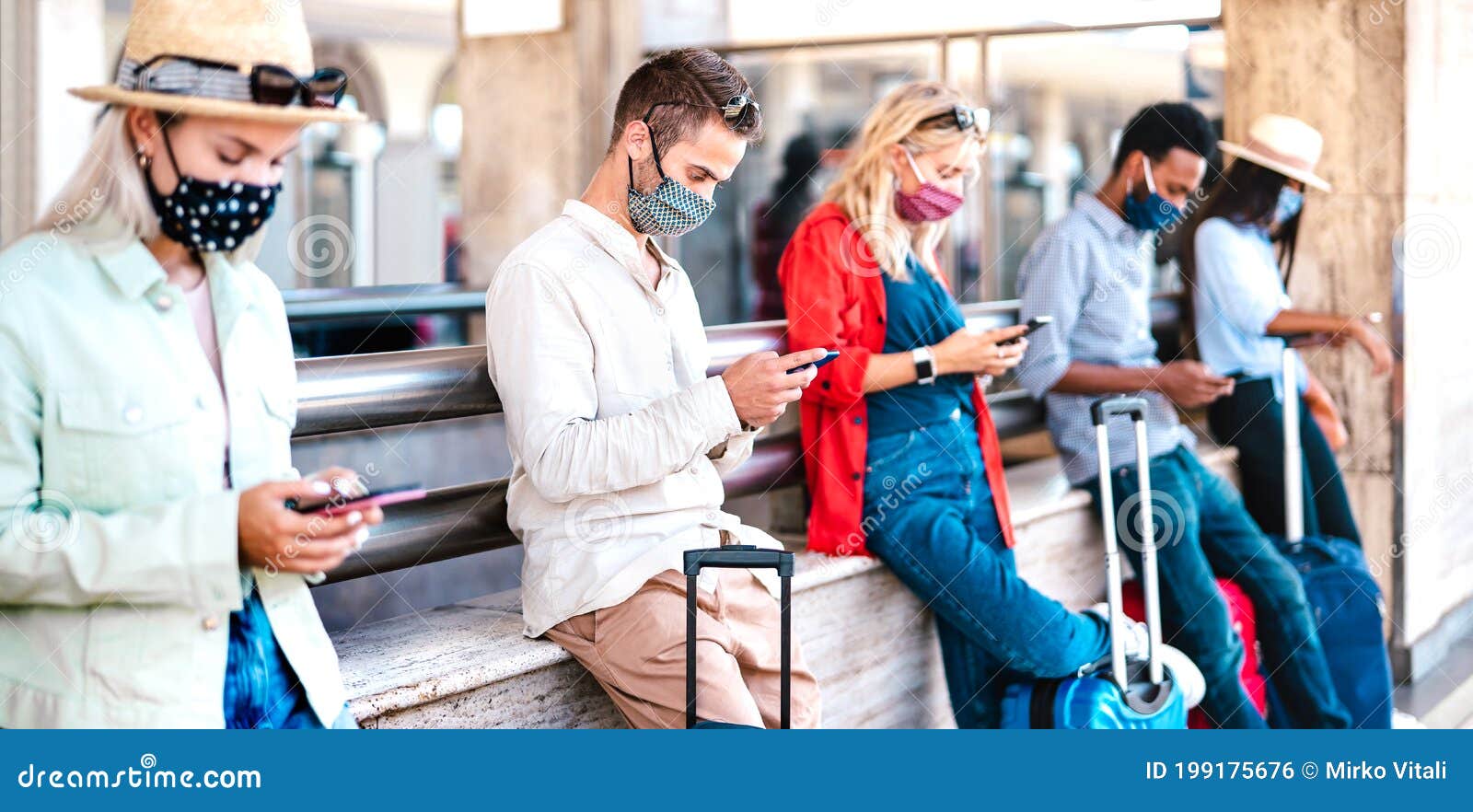 multiracial friends wearing face mask using mobile smart phones - young millenial checking online reservations at train station