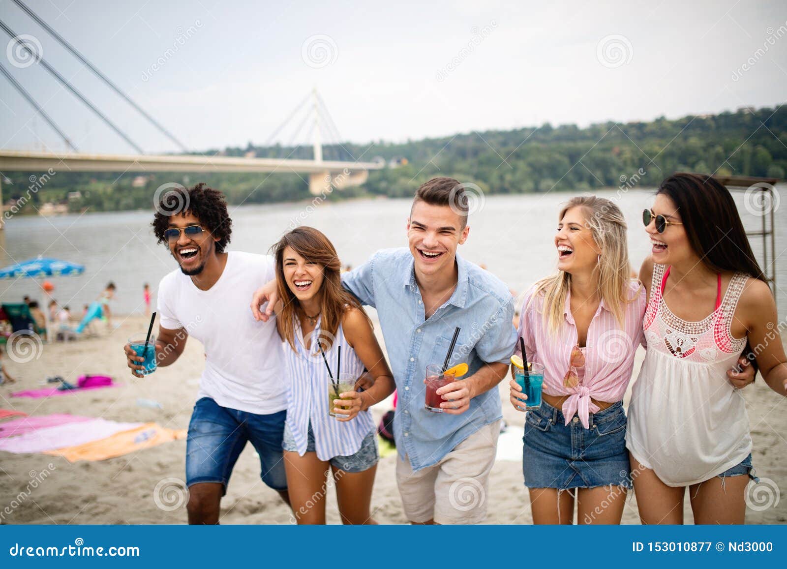 Multiracial Group of Friends Enjoying a Day at Beach. Stock Image ...