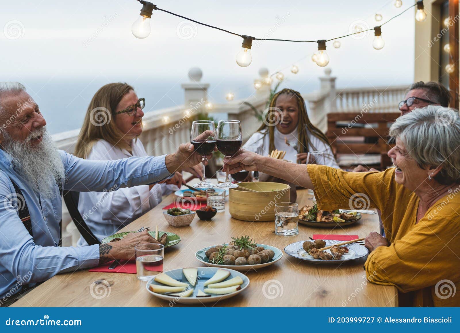 https://thumbs.dreamstime.com/z/multiracial-senior-friends-having-fun-dining-together-toasting-red-wine-house-patio-dinner-food-holidays-concept-203999727.jpg