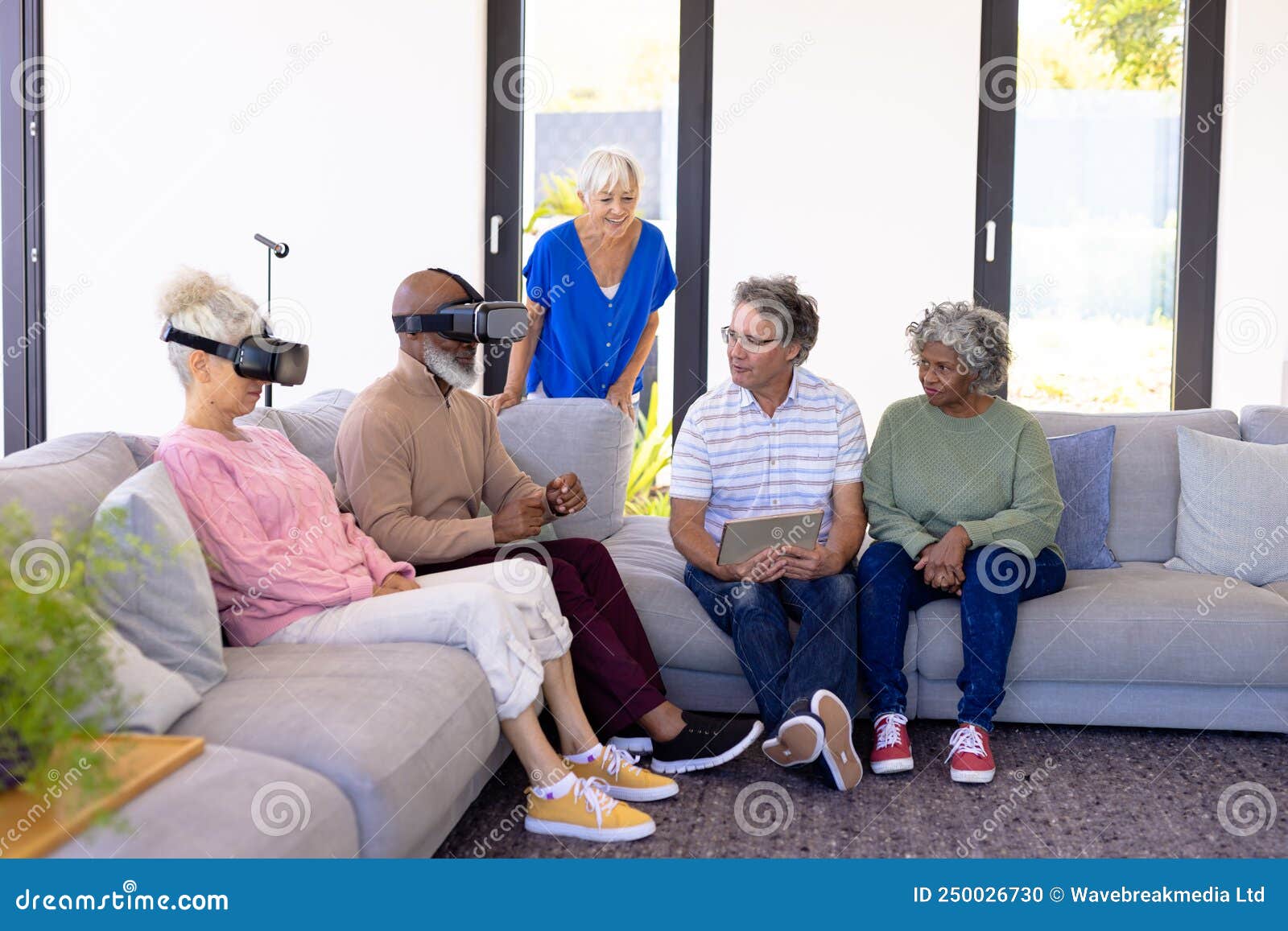 Multiracial Seniors with Digital Pc Looking at Friends Using Virtual