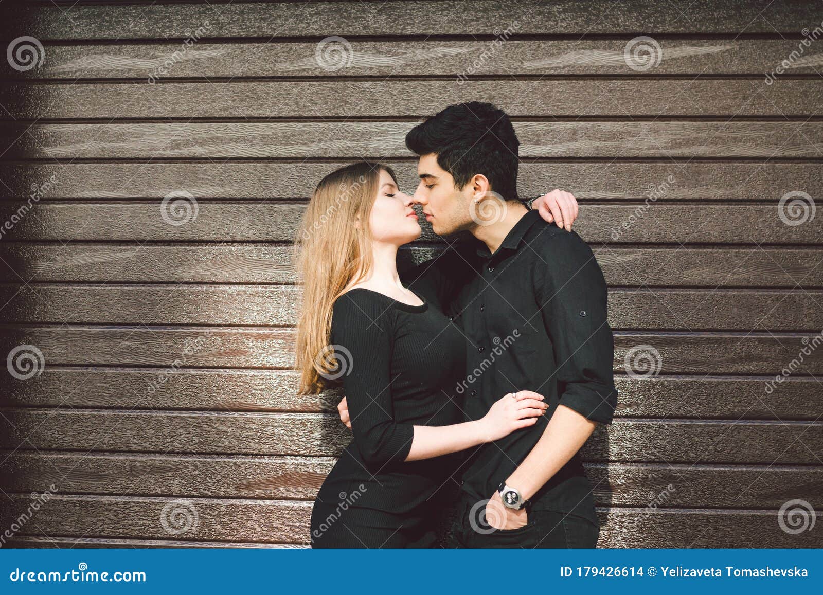 Multiracial Stylish Couple in Black Clothes Posing on a Background ...