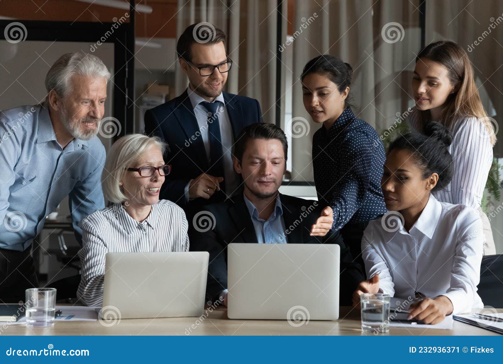 multiracial team of business executives gather for brainstorm at workplace