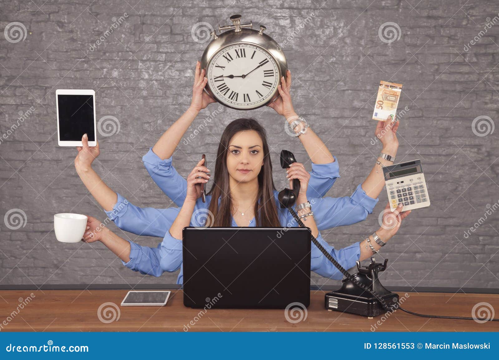 multitask businesswoman sat at the desk in the office, concept o