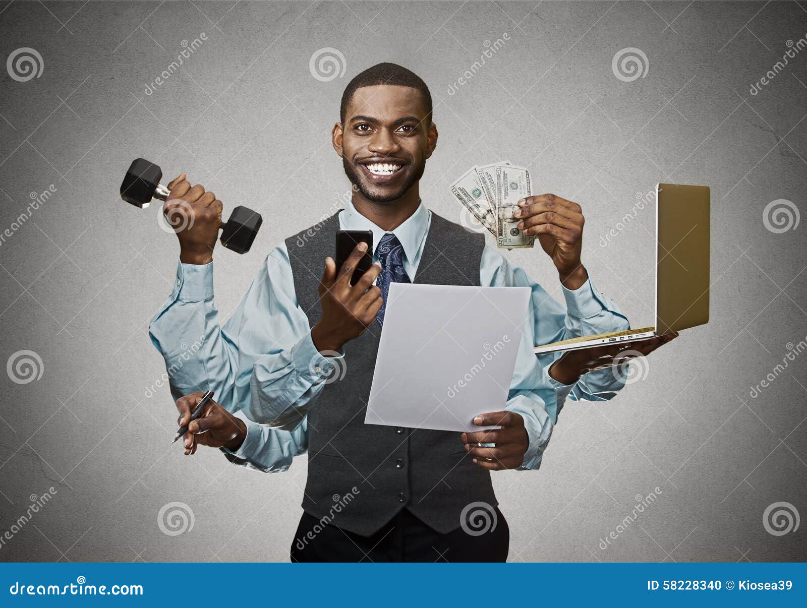 multitasking happy business man on grey wall background