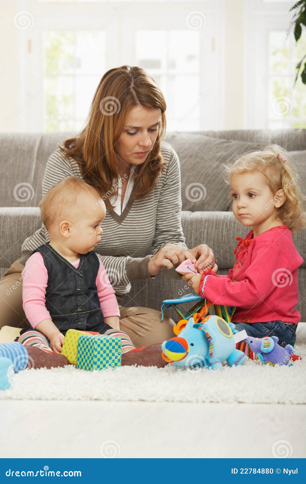 mum playing with two daughters