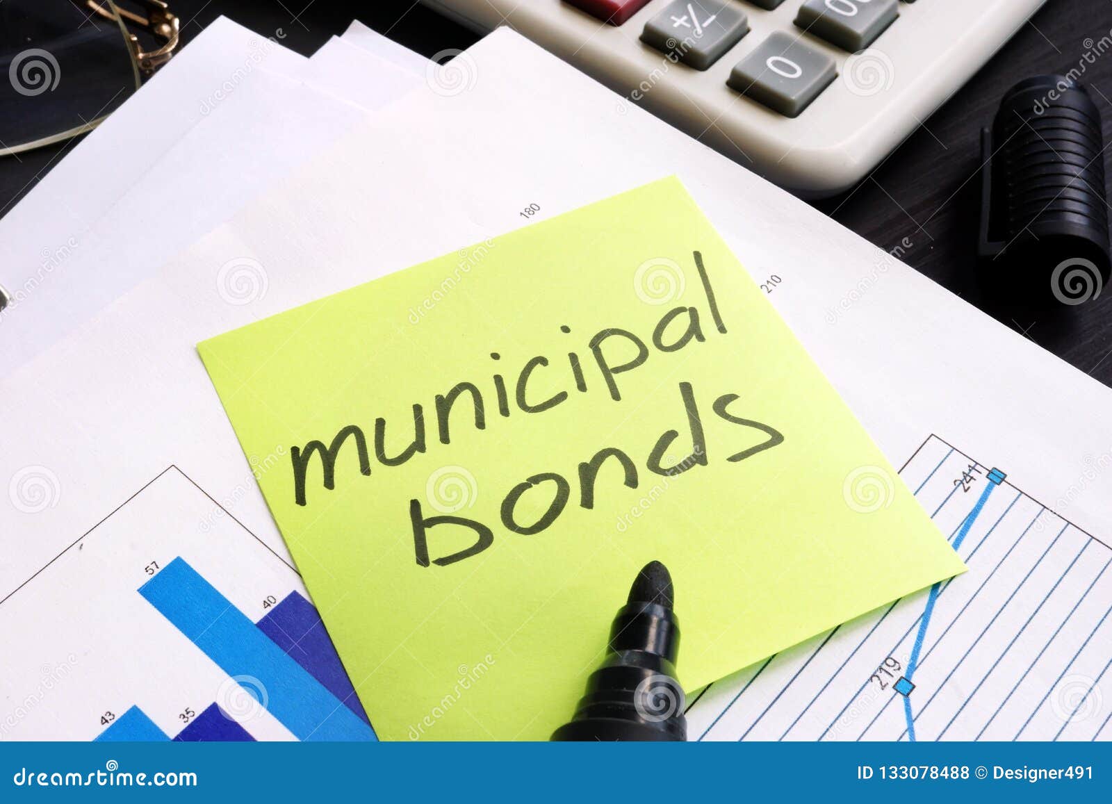 municipal bond written on a memo stick and documents