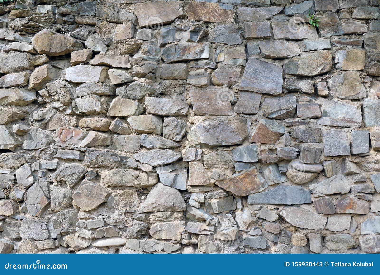 Um muro de pedra com um muro de pedra com textura de pedra.