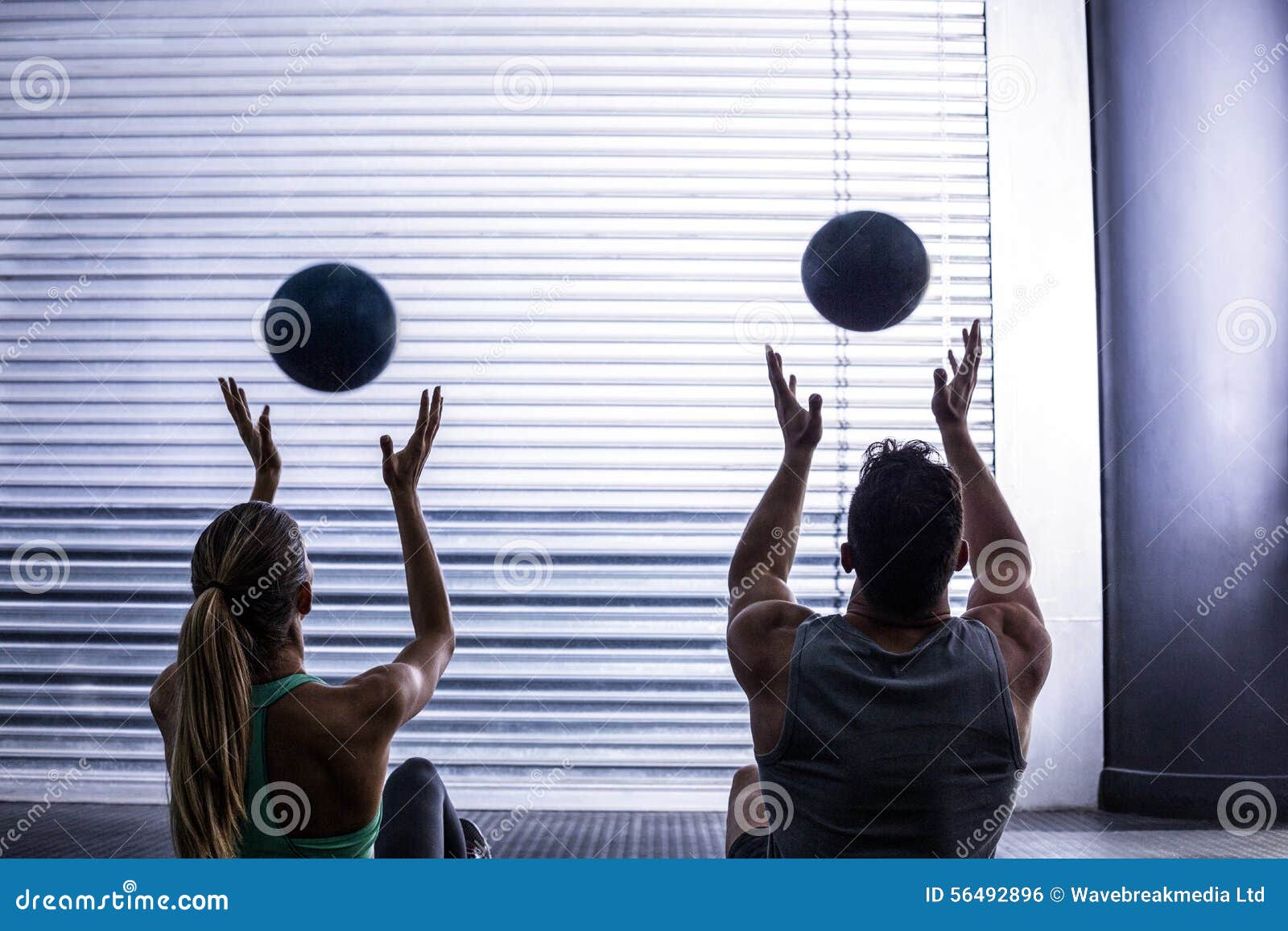 Muscular Couple Throwing Ball in the Air Stock Photo Image of fitness