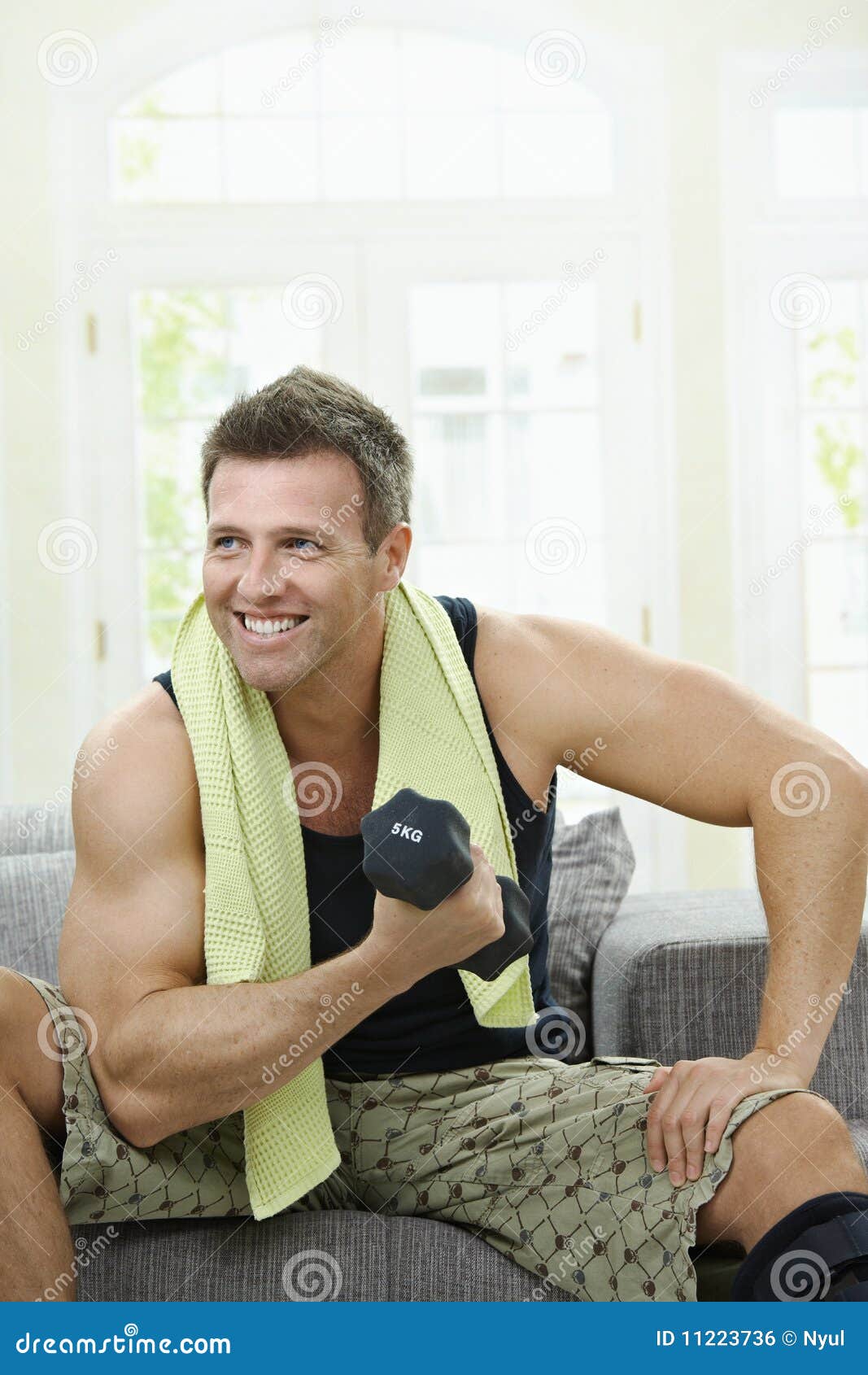 Muscular Man Doing Excercise Stock Photo - Image of alone, furniture ...
