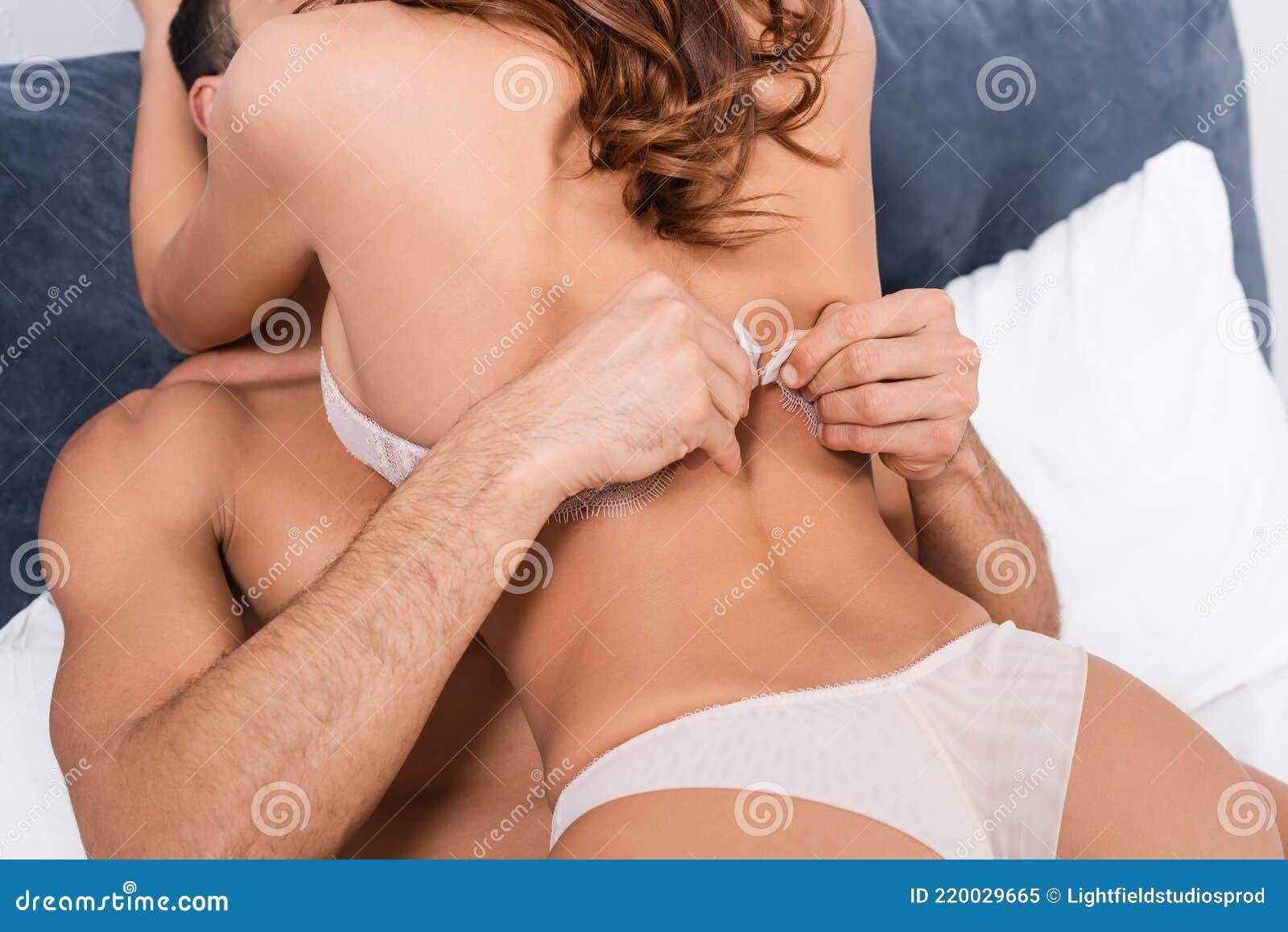 Muscular Man Taking Off Bra from Stock Image - Image of couple, indoors:  220029665