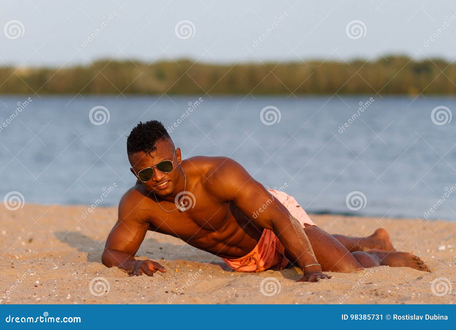 black muscle man on beach