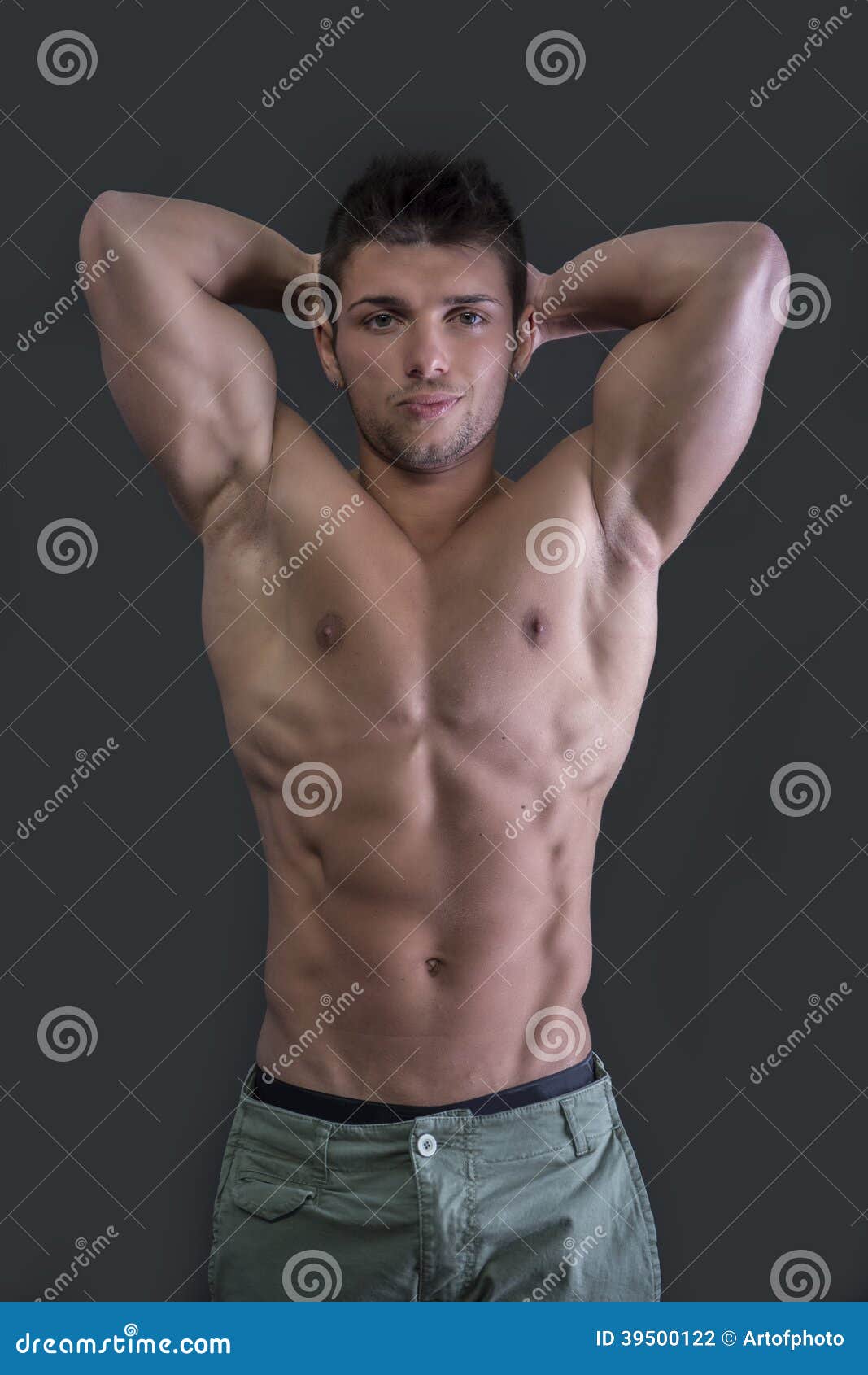 Muscular Young Bodybuilder Showing Biceps and Ripped Abs Stock Photo -  Image of head, body: 39500122