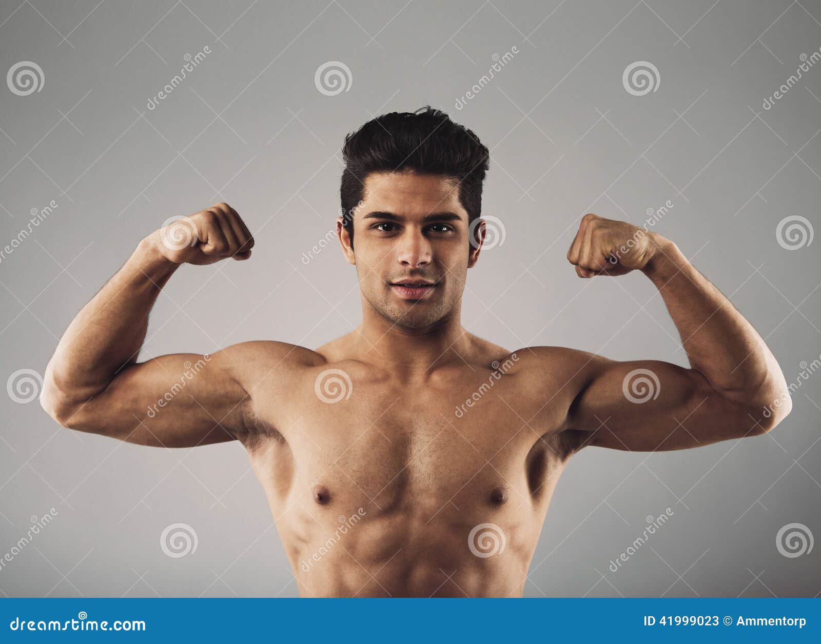 Muscular Young Man Showing Off His Defined Body Stock Image - Image of  adult, bicep: 41999023