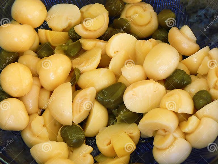 Mushrooms and caper in oil stock photo. Image of ingredients 3801192