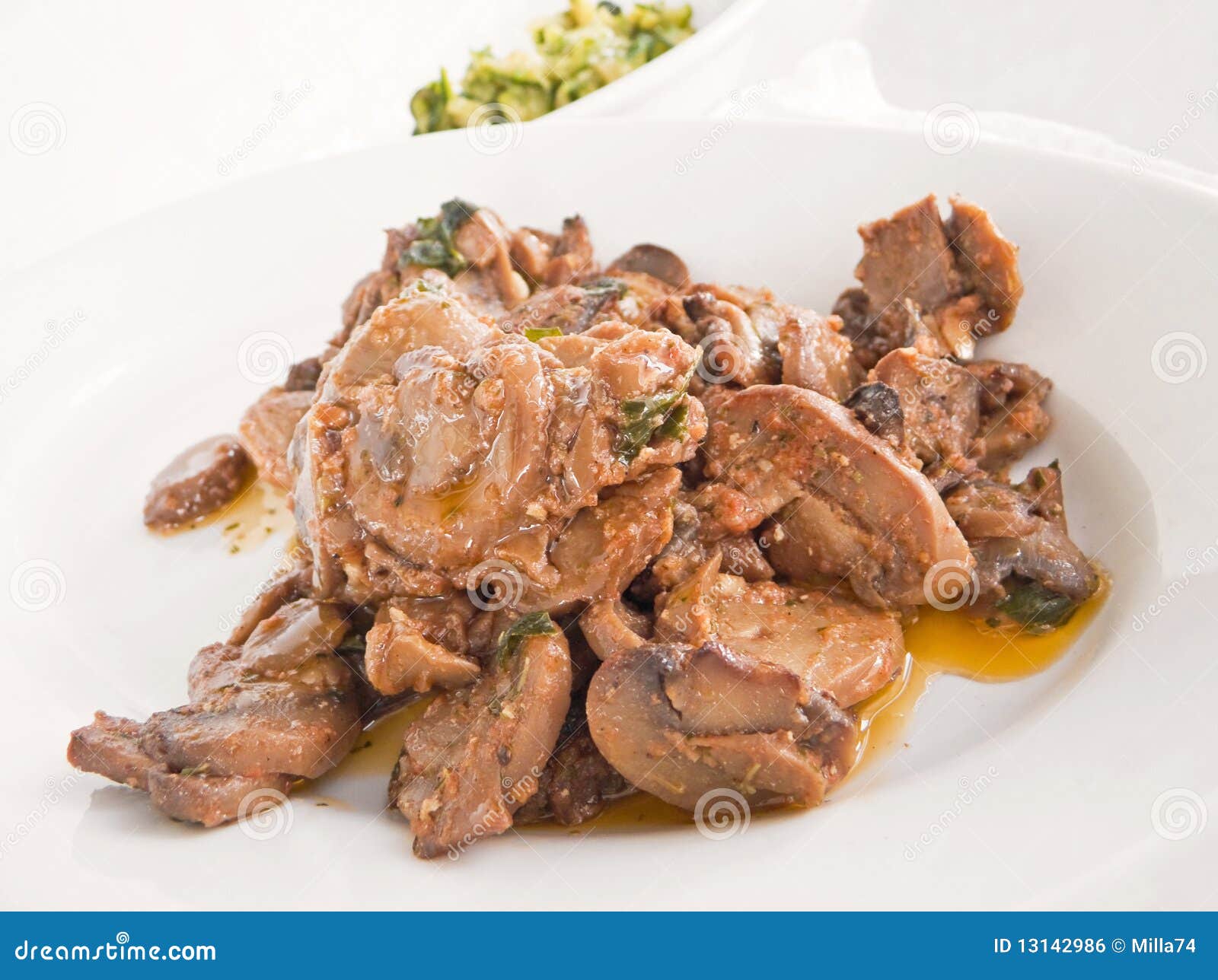 Mushrooms Cooked with Olive Oil and Tomato Sauce. Stock Photo Image