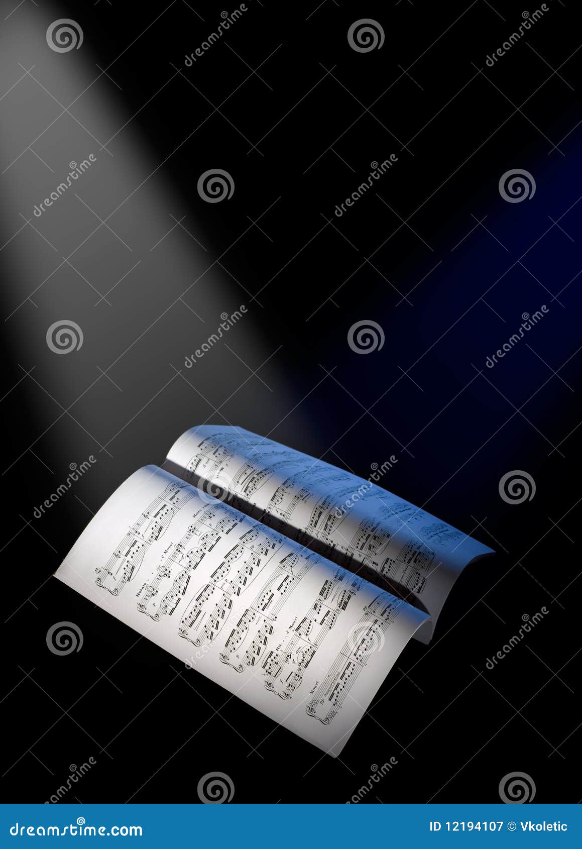 music sheets under the reflector lights