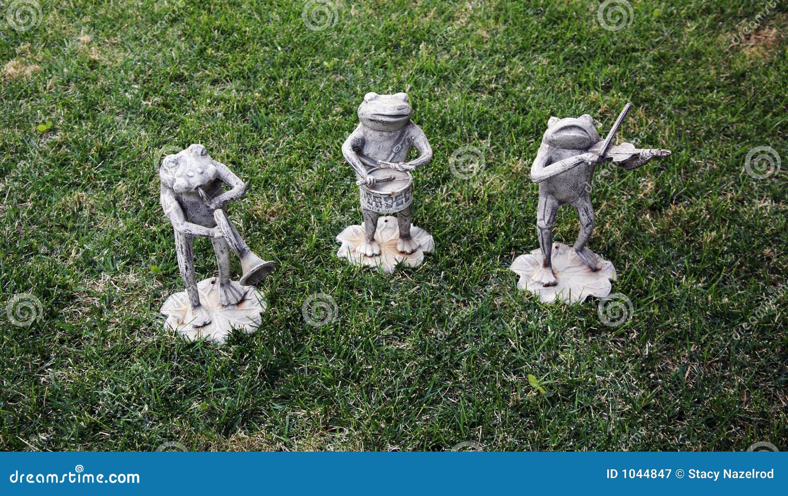 Musical frog statues stock image. Image of rust, play 1044847