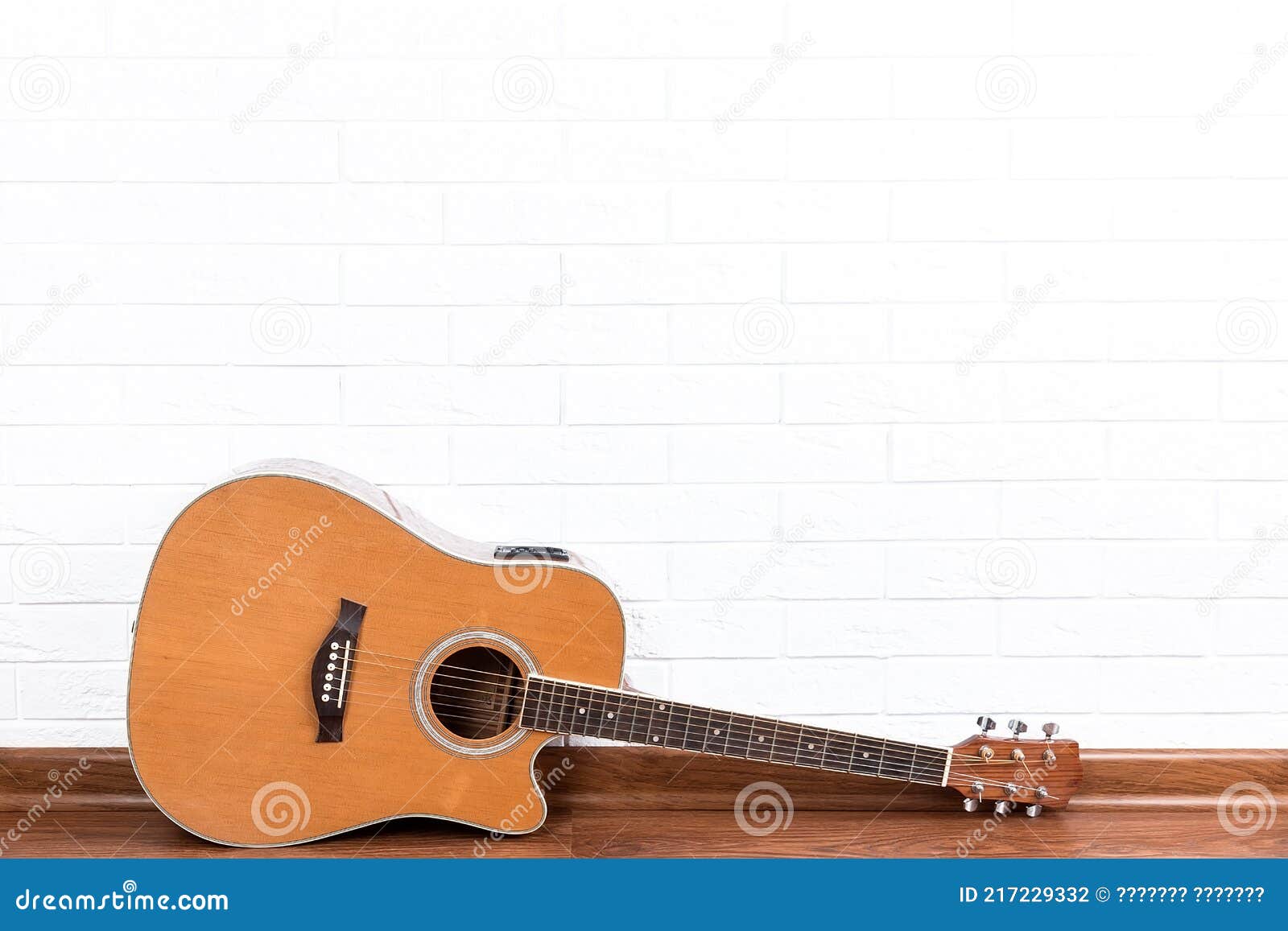 Guitar on a Brick Wall Background Stock Photo - Image of copyspace