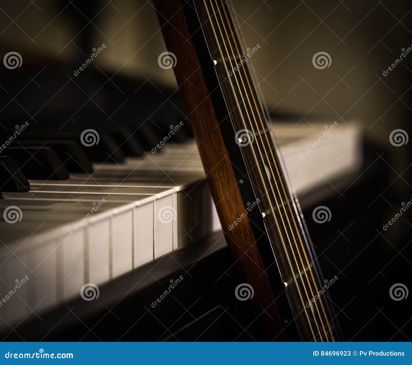 Musical Instruments Piano Keys and Acoustic Guitar Stock Image Image