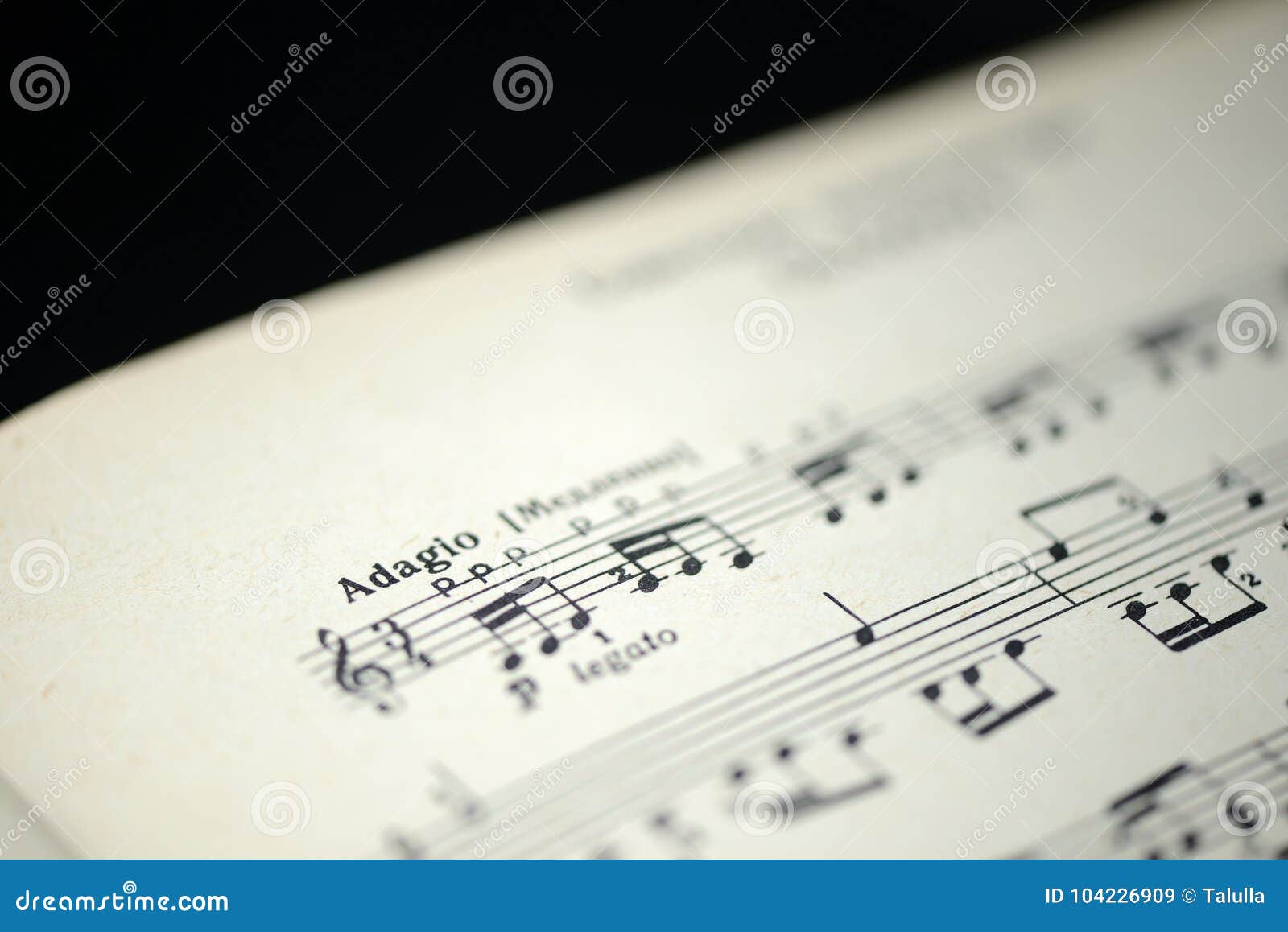 musical tempo `adagio` in an old music notebook