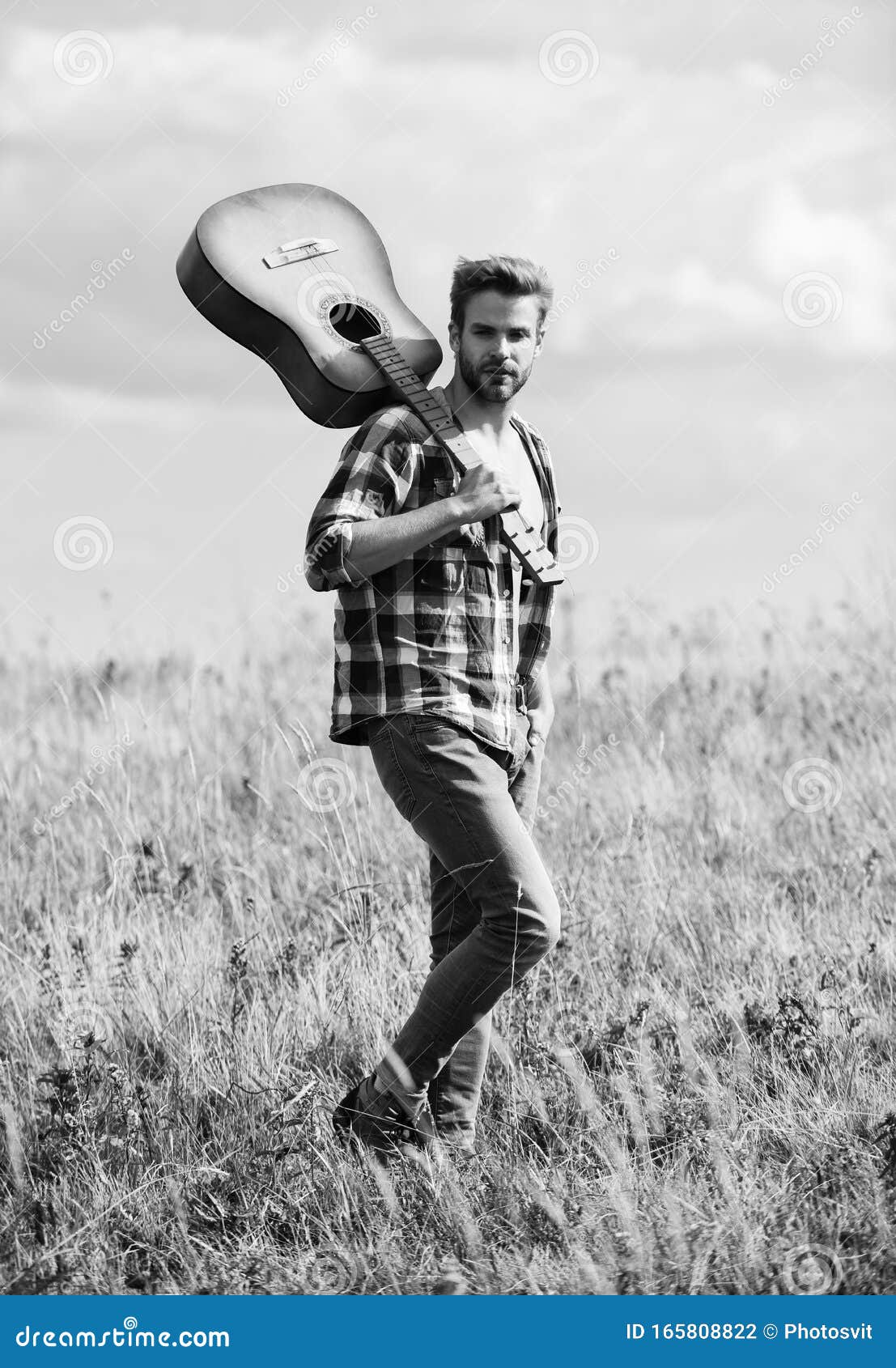 musician looking for inspiration. wanderlust concept. inspiring nature. guy with guitar contemplate nature. in search of