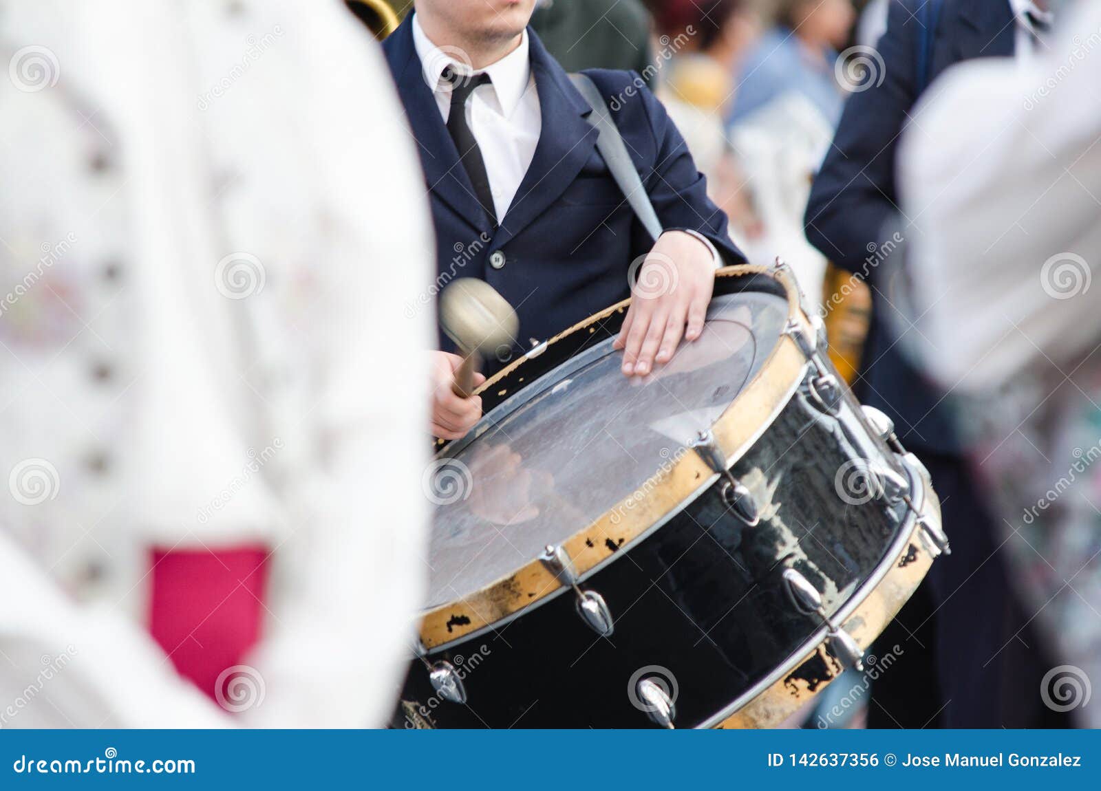 musician playing the drum in the festival of the fallas of valencia
