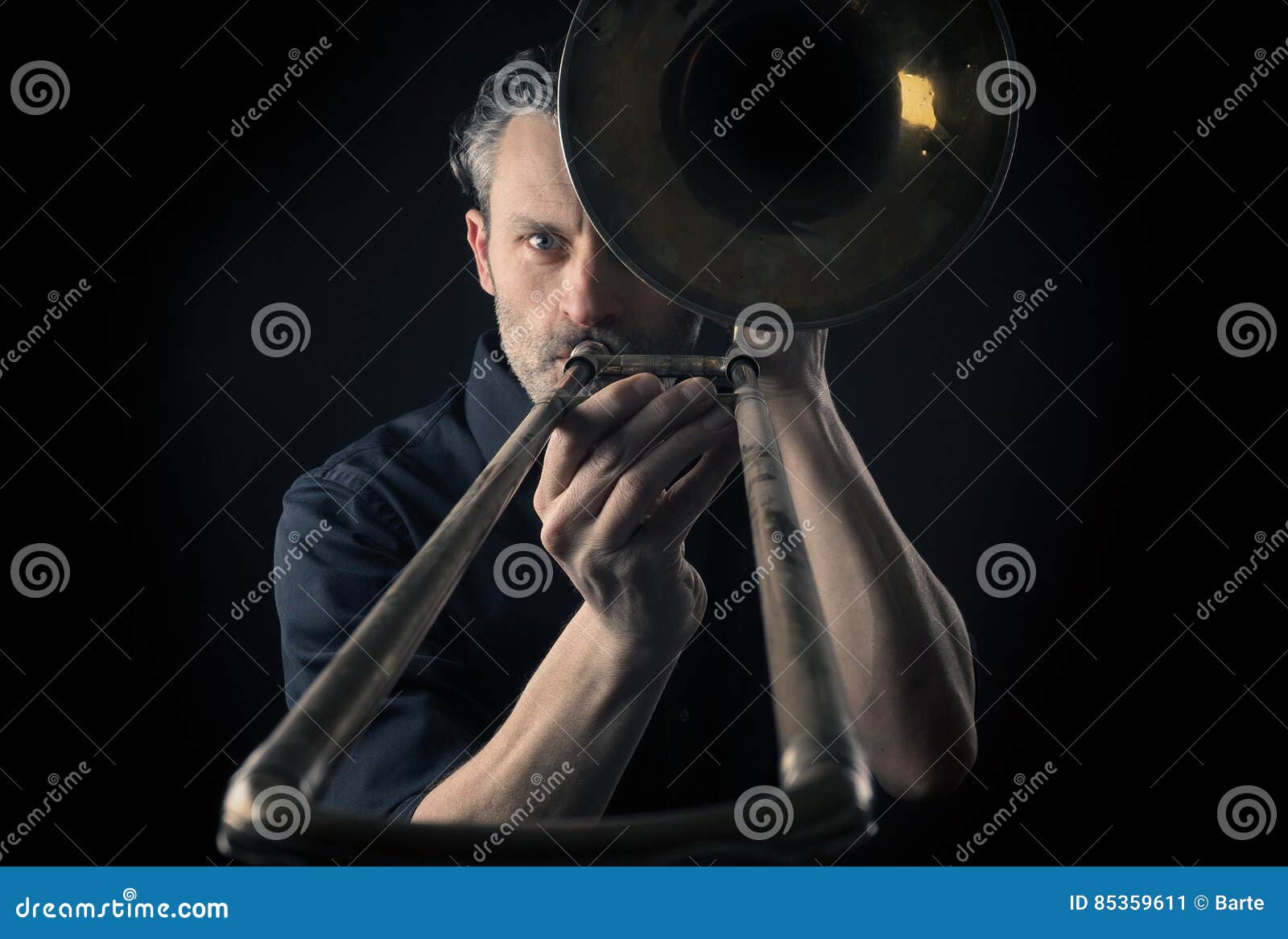 Musician with a trombone stock image. Image of used, trombone 85359611