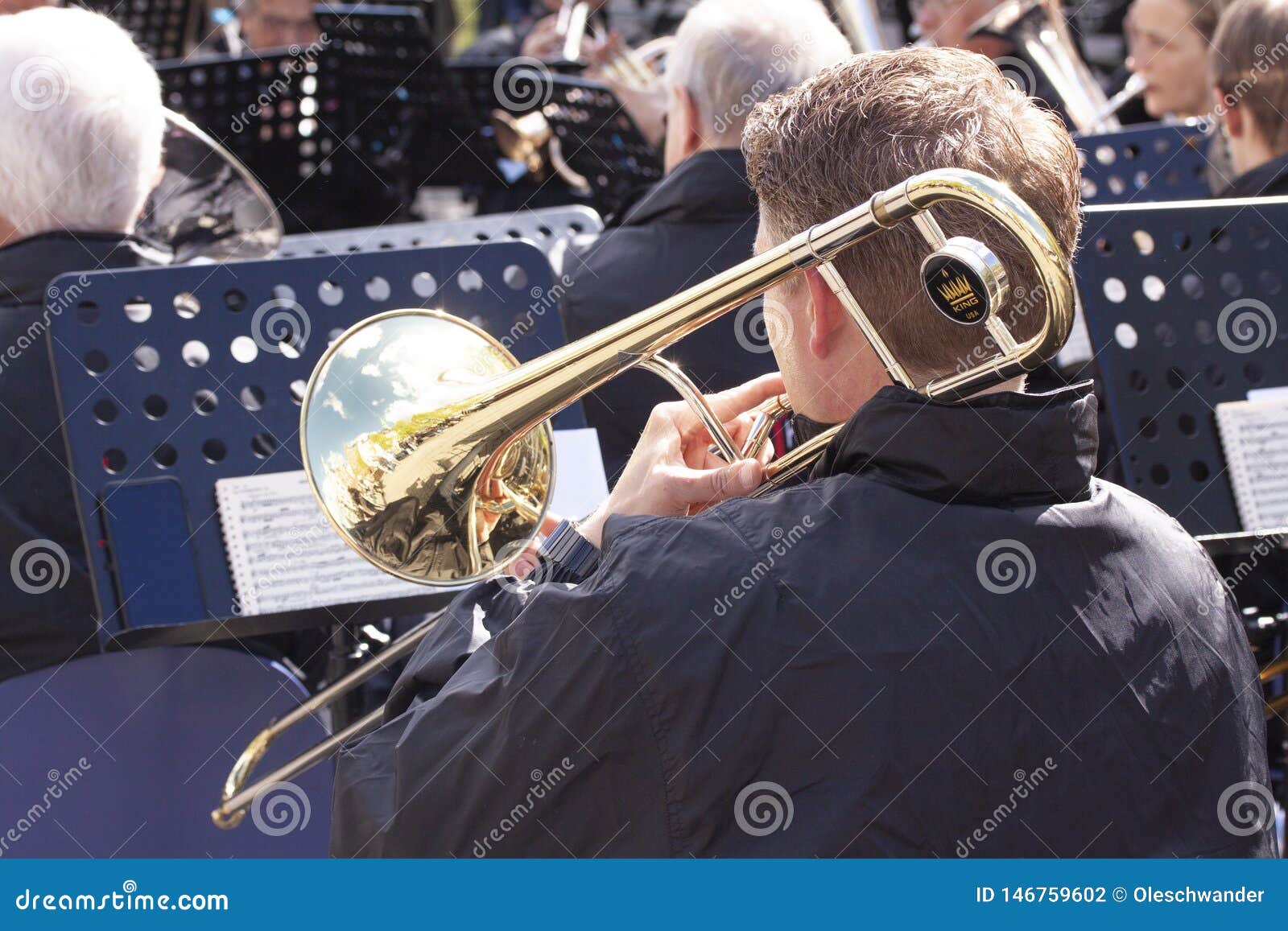 Musicians from a Brass Band Playing Outside in a Town Market Square