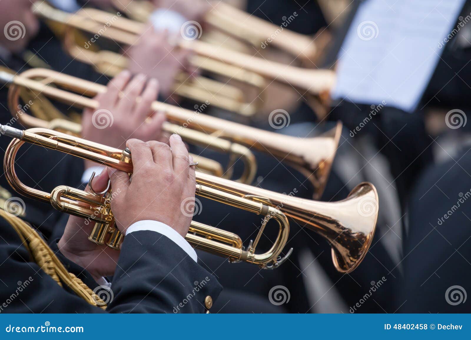 musicians playing on trumpets