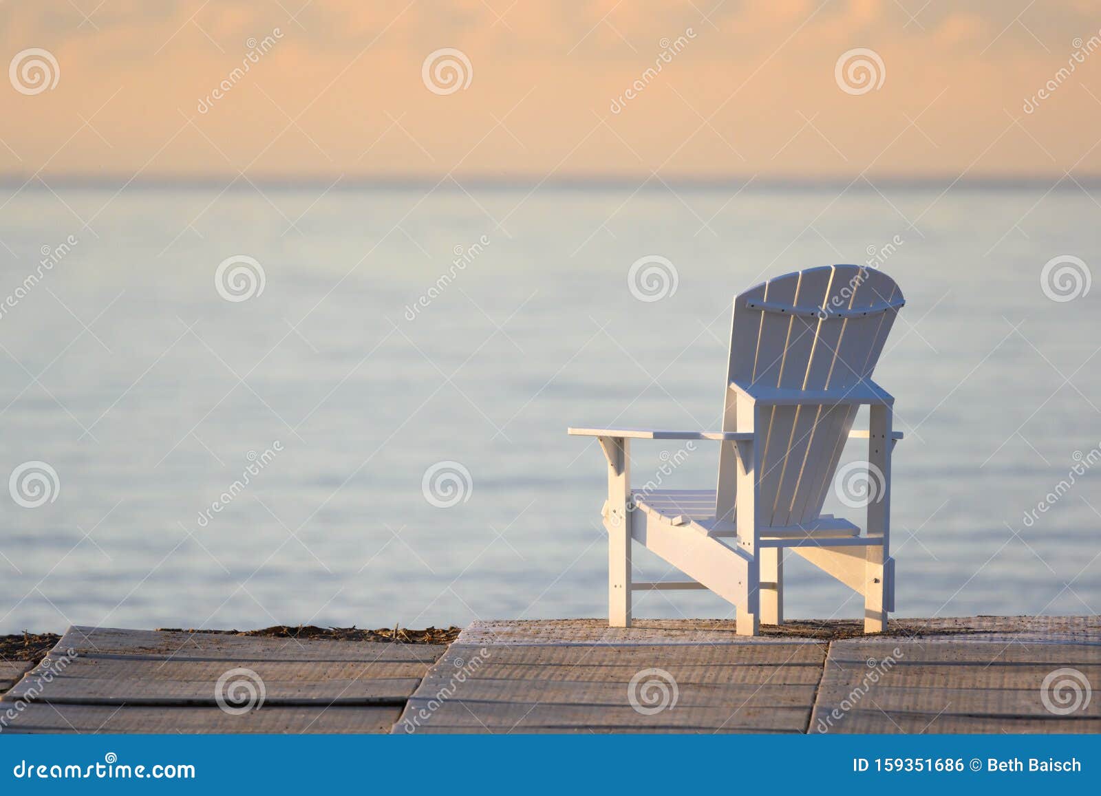 muskoka chair overlooking lake ontario, woodbine beach, toronto