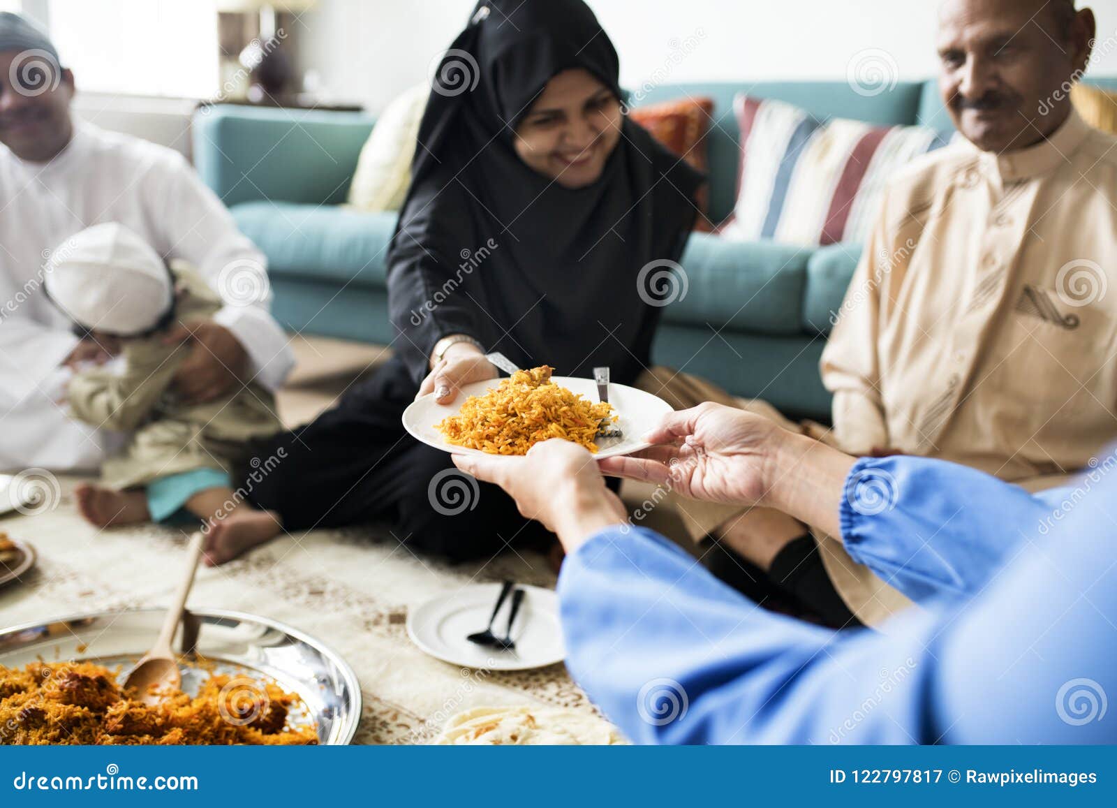 muslim family having dinner on the floor