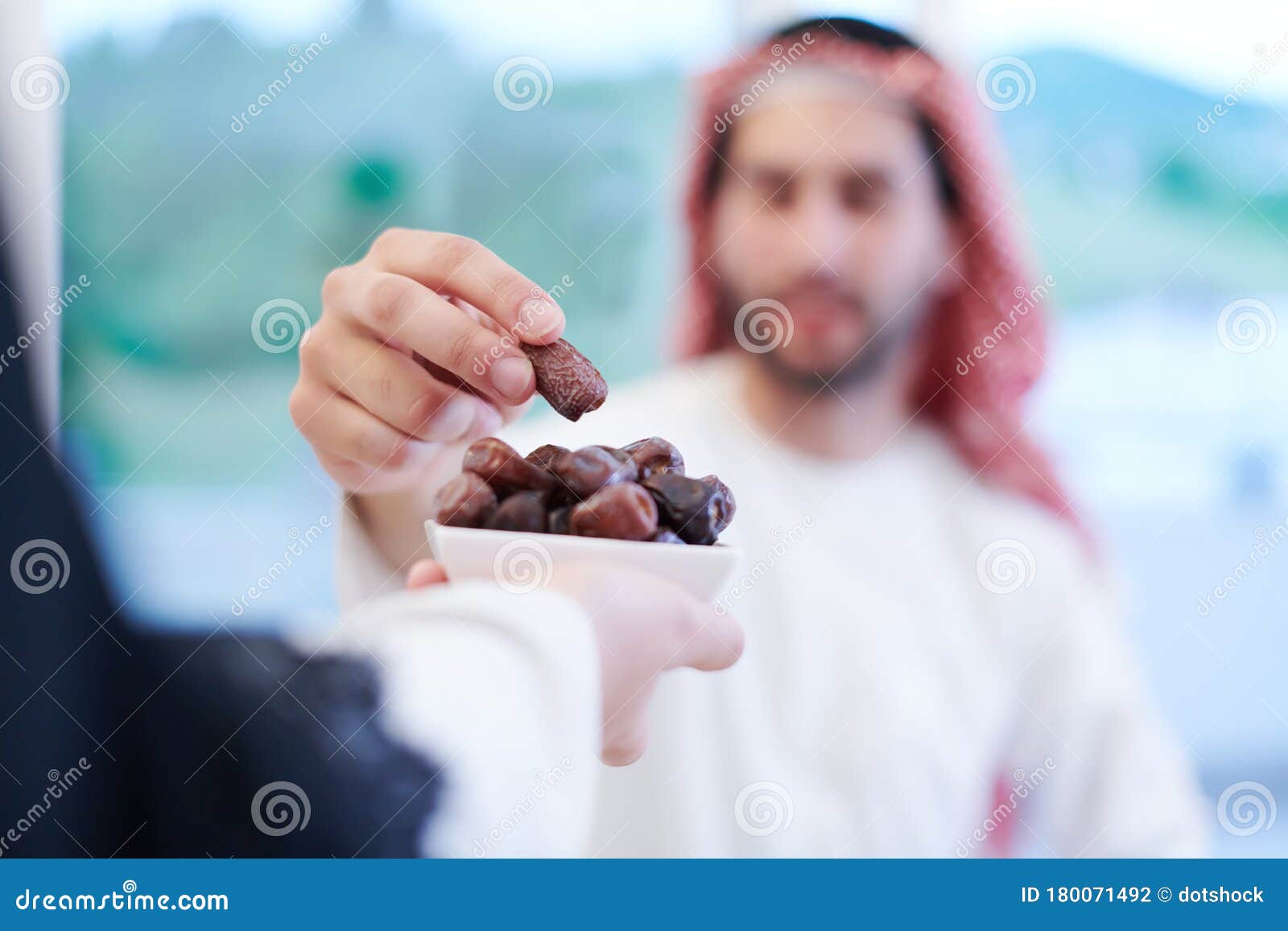 Muslim Family Having Iftar Dinner Eating Dates To Break Feast Stock