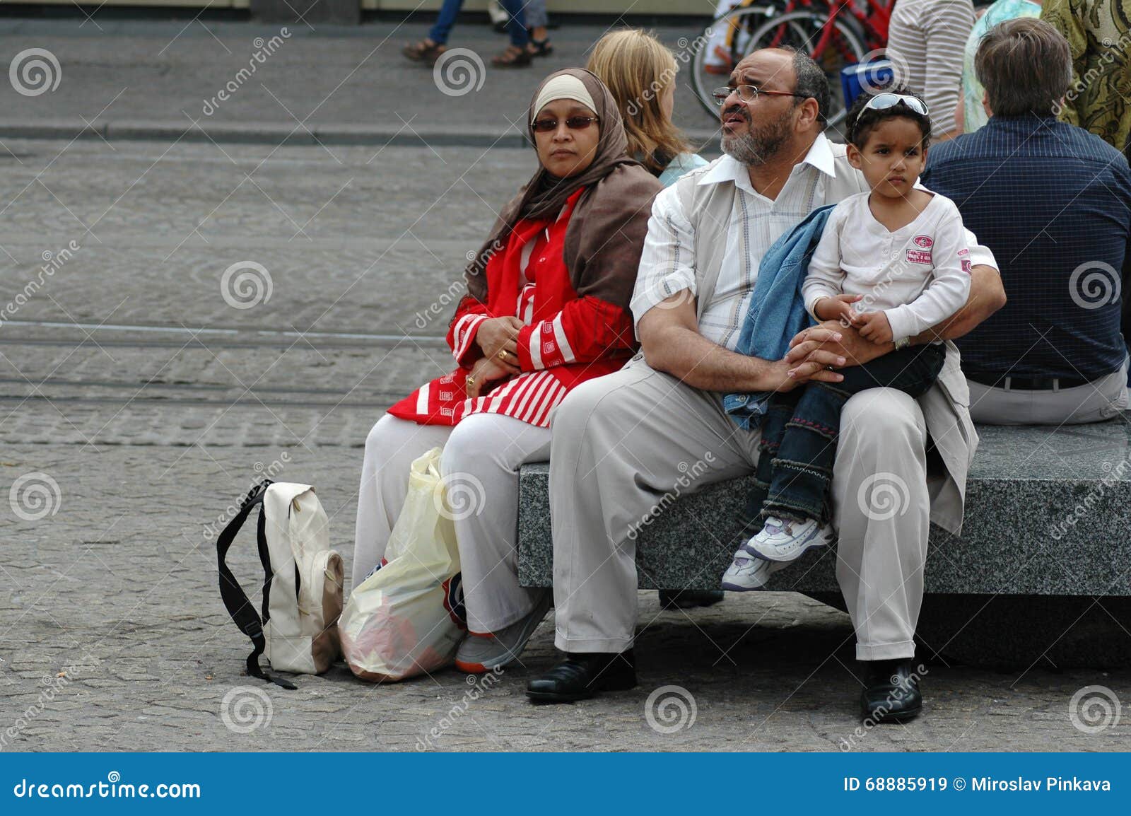 Muslim Family Resting on the Street Editorial Stock Image - Image of