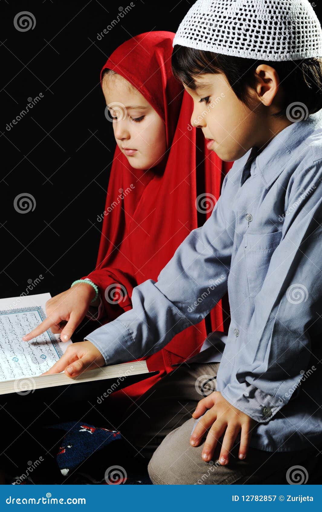 muslim girl and boy on black background