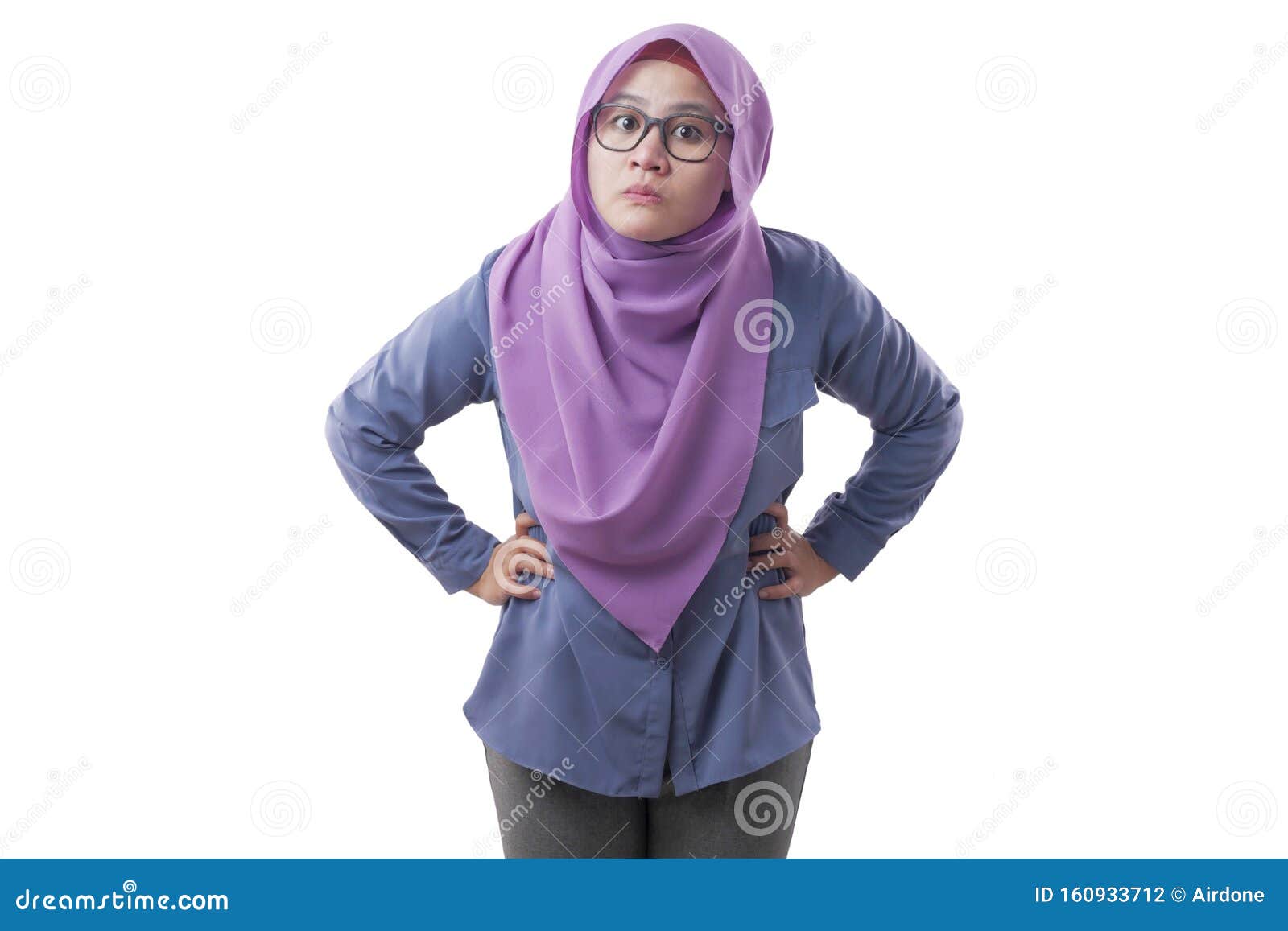 muslim woman pointing at camera with angry expression, giving warn