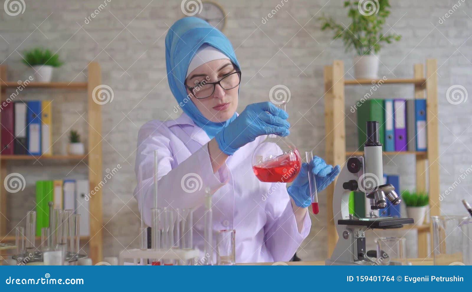 Muslim Woman Scientist Chemist in National Scarf Working in the Lab ...