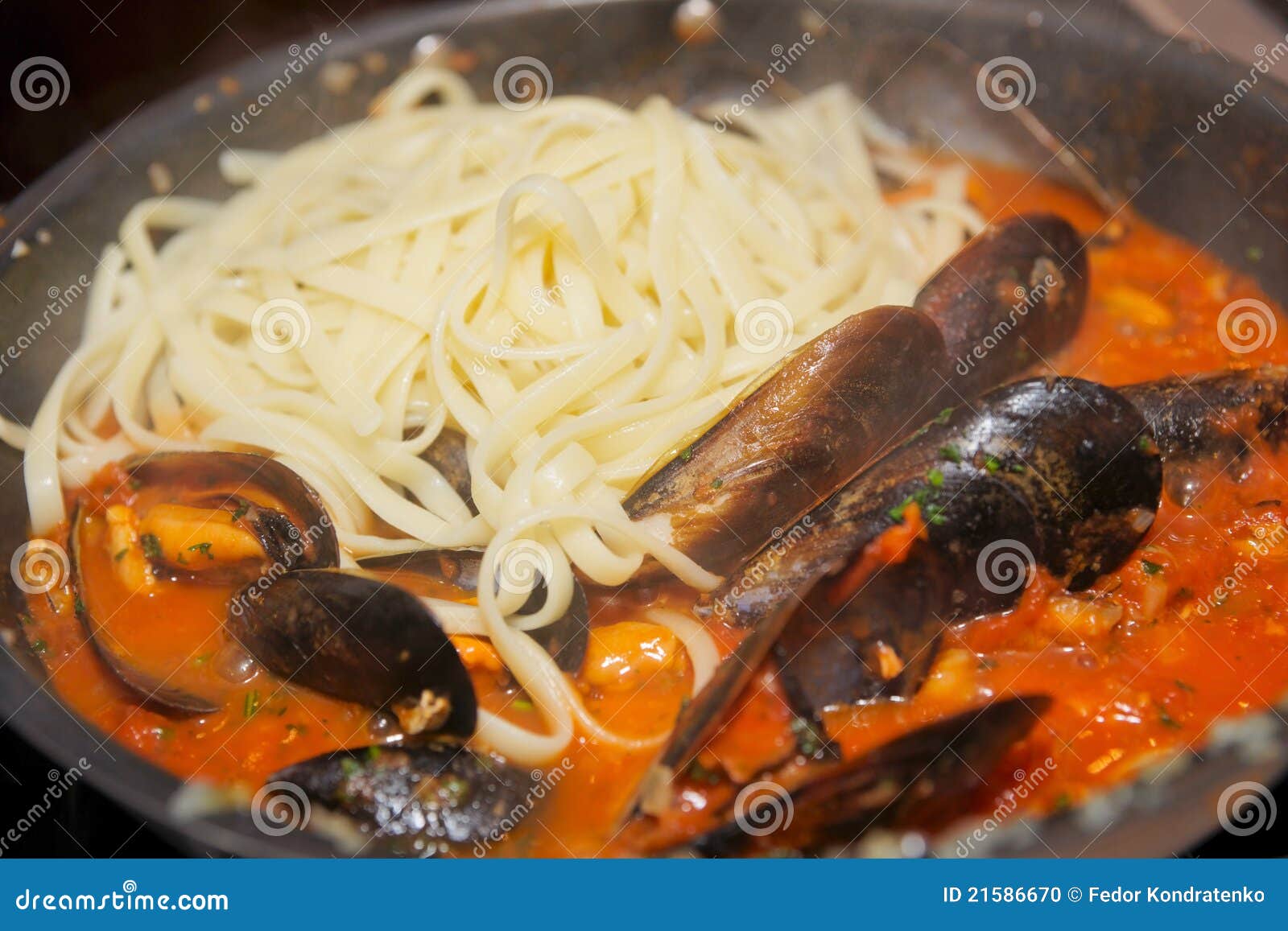 Mussels Being Fried with Tomato Sauce and Pasta Stock Photo Image of