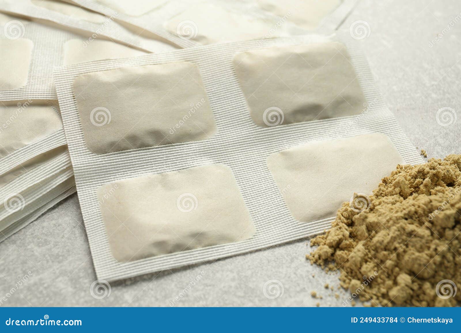 Mustard Powder and Plasters on Light Grey Table, Closeup Stock Photo