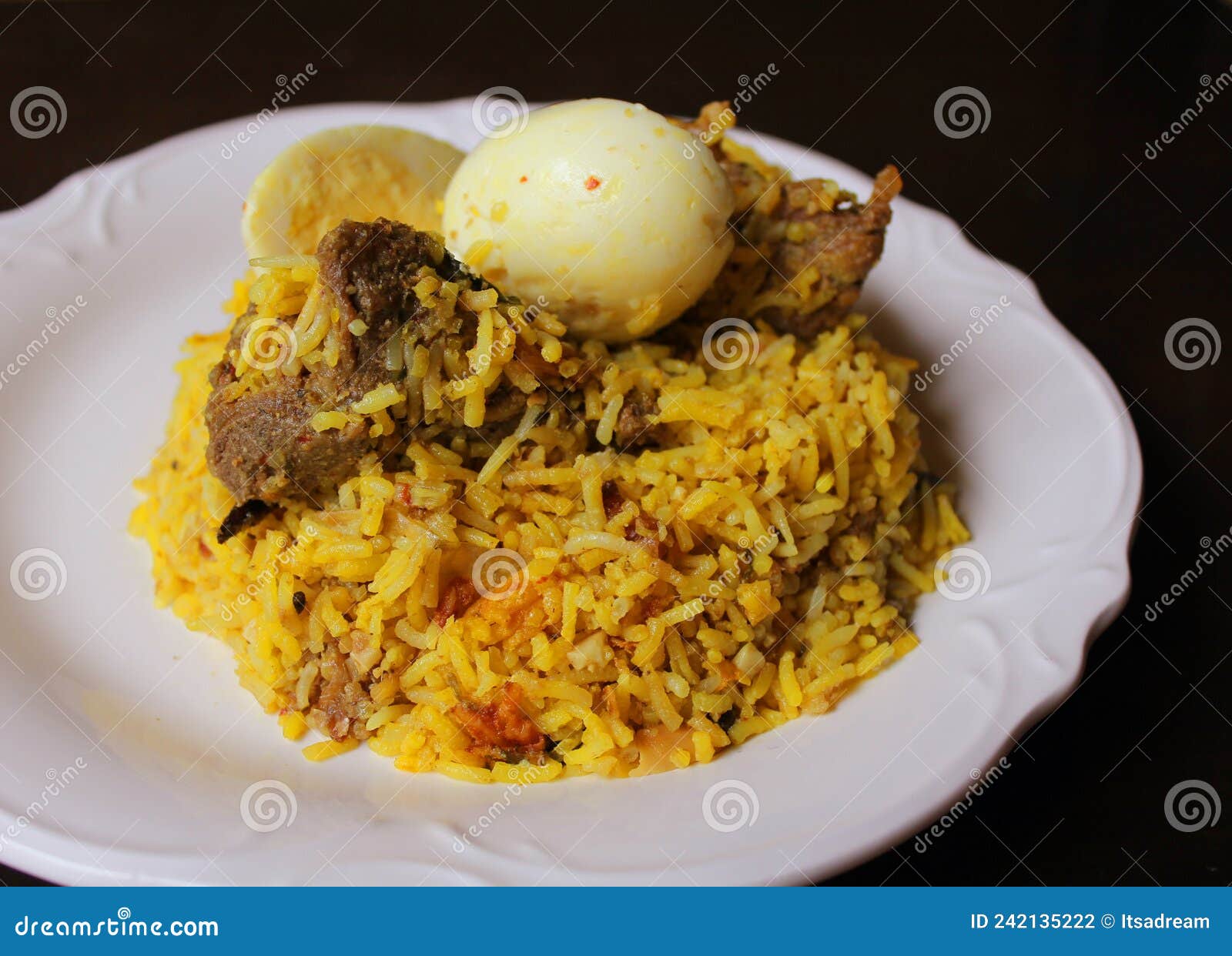 mutton biryani topped with boiled egg
