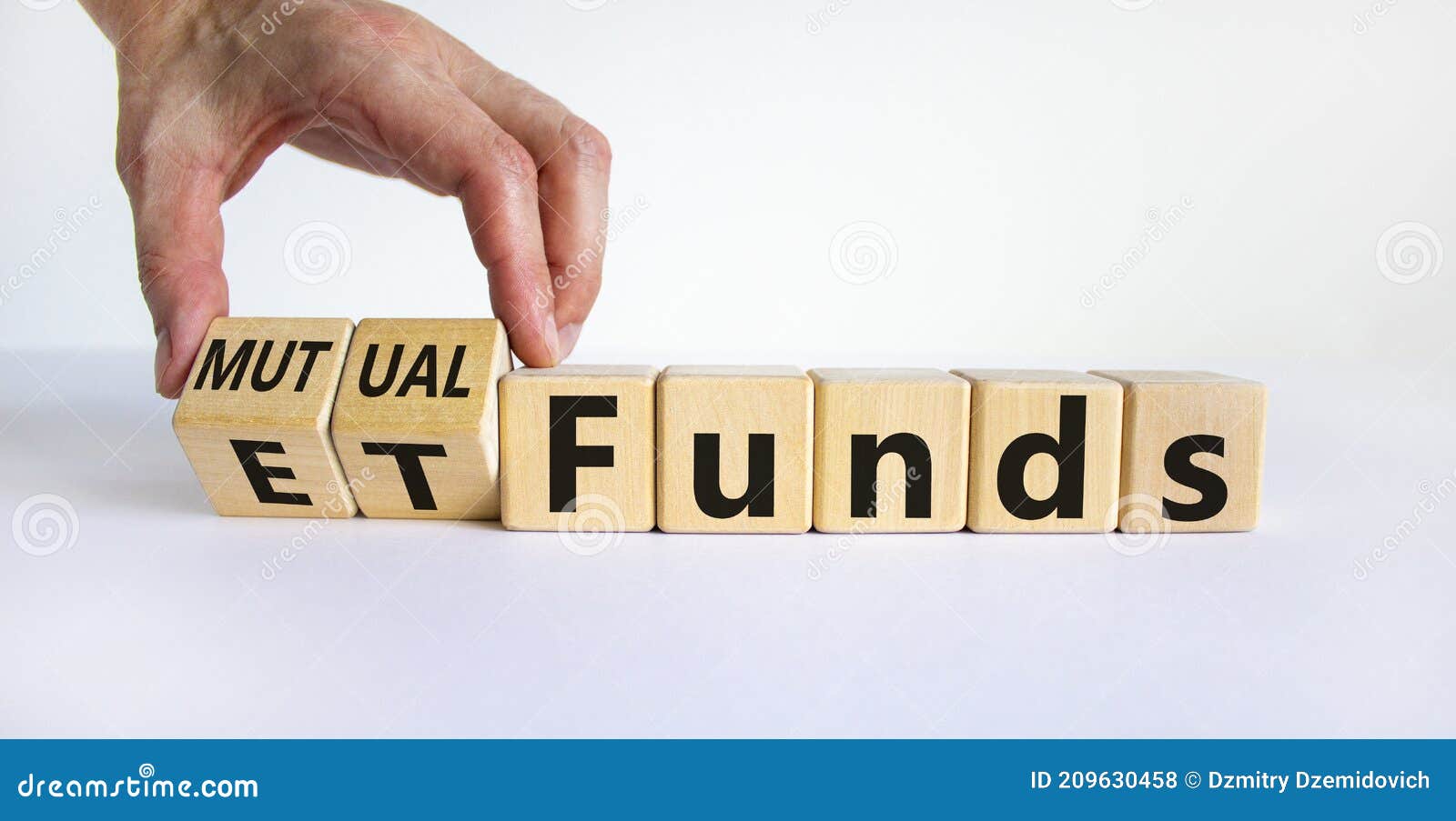 mutual funds vs etf . businessman turns a cube and changes words `etf, exchange-traded fund` to `mutual funds. beautiful