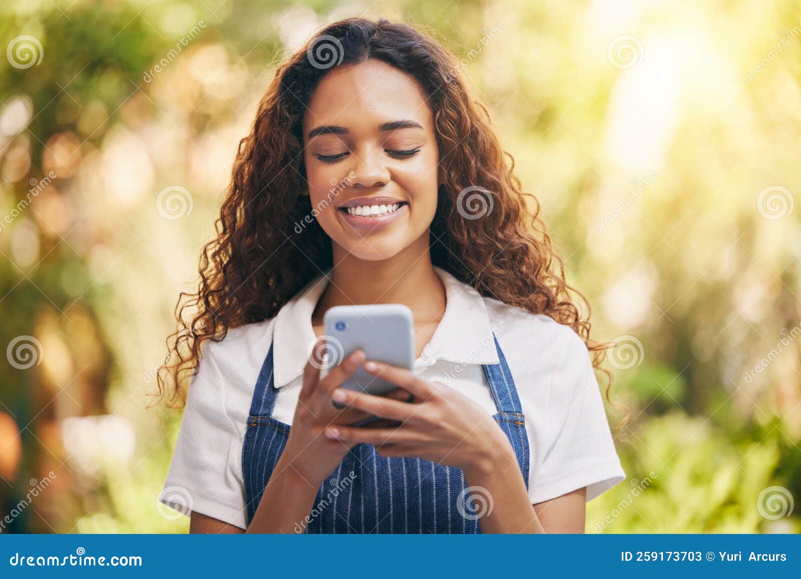 My order is on its way a young florist using her smartphone to send a