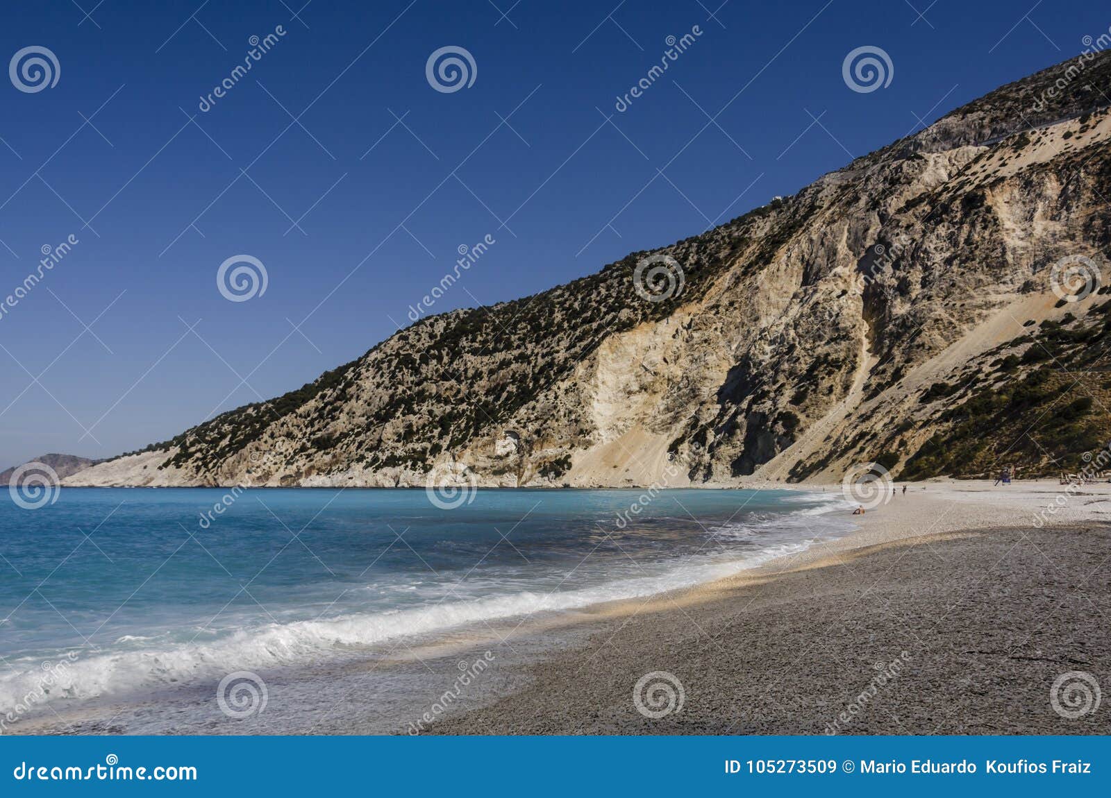 breaking coastal line turquoise sea and mountain in myrtos beach