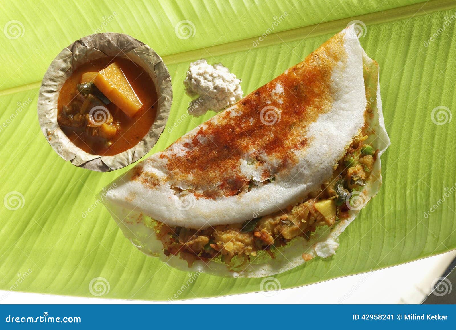 mysore masala dosa stuffed with potato masala, chutney and sambhar