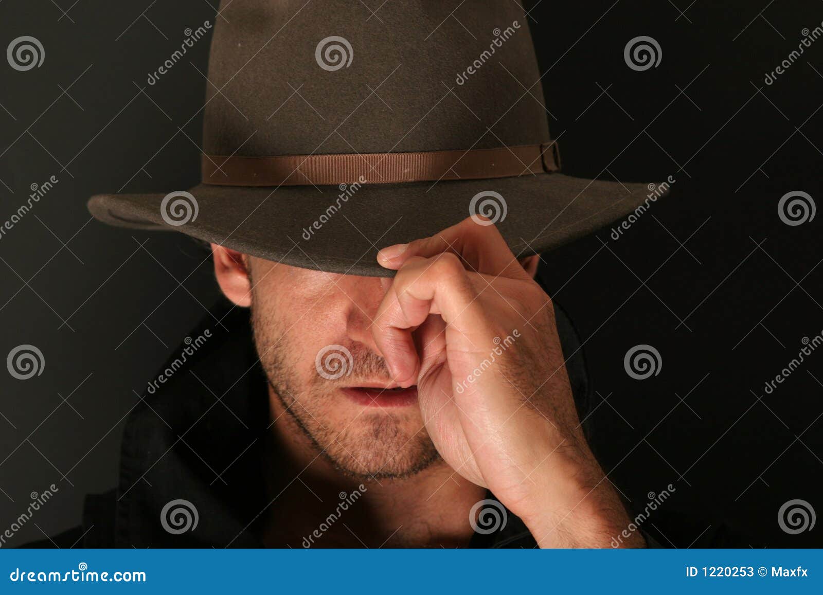 mystery man with hat