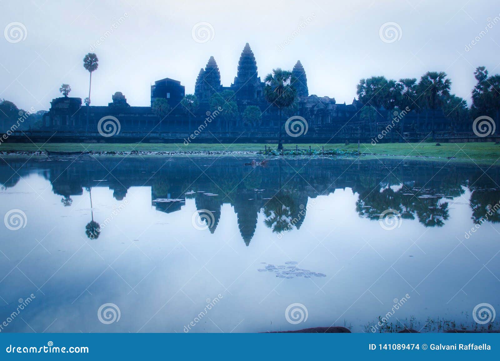 Mystical Atmosphere at Sunrise at Angkor Wat Buddhist Temple Stock