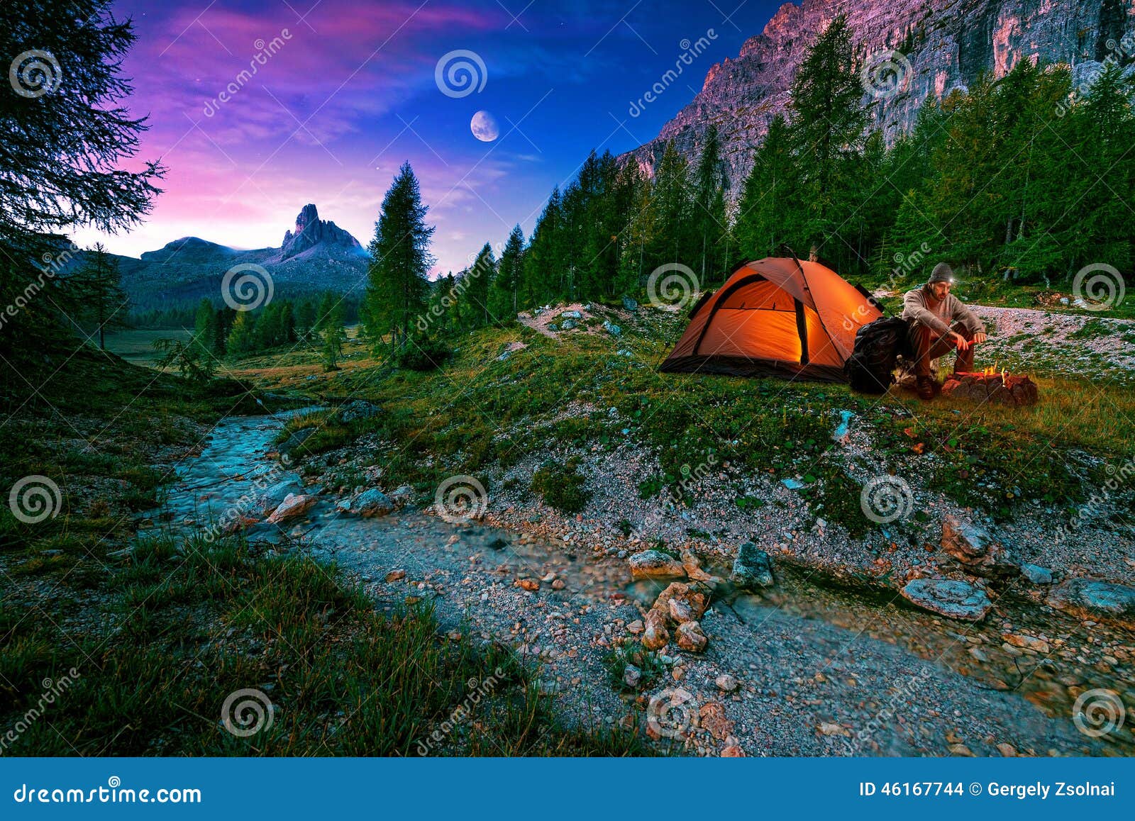 mystical night landscape, in the foreground hike, campfire and tent