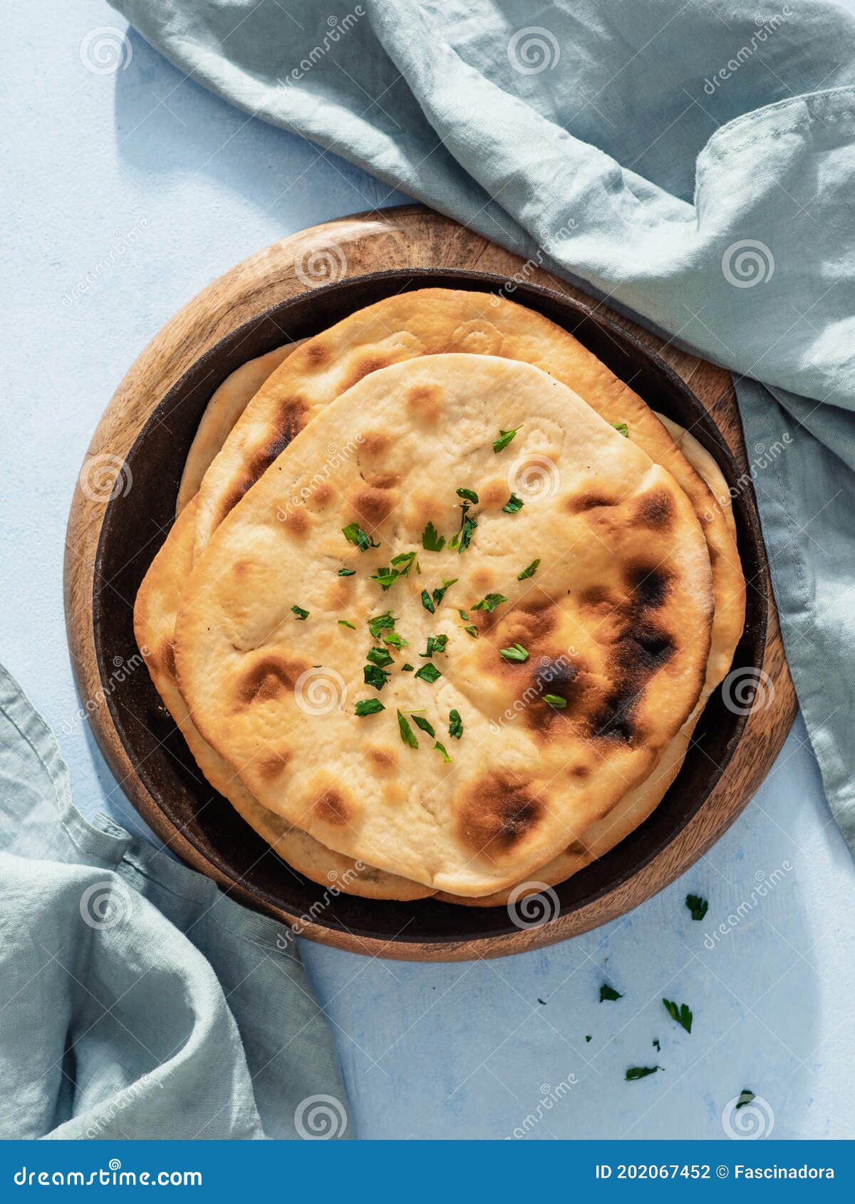 naan flatbread on blue, copy space, top view