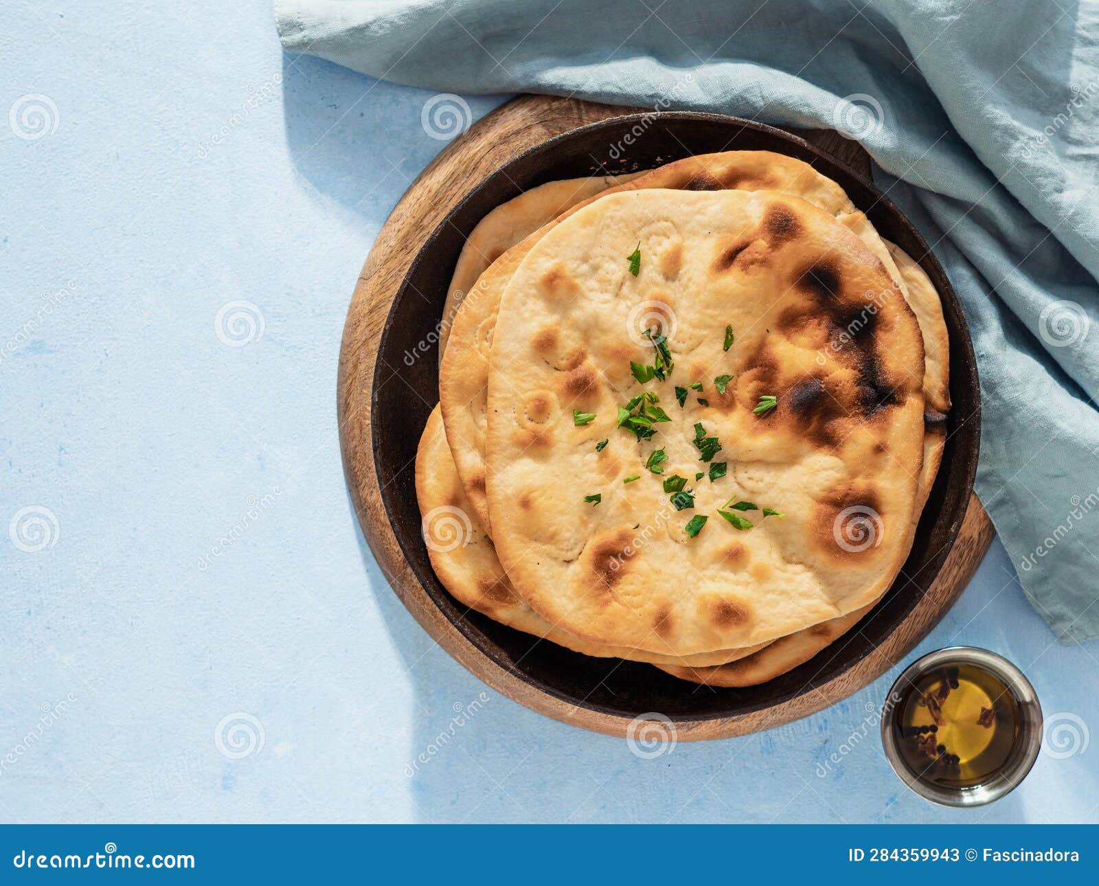naan flatbread on blue, copy space, top view