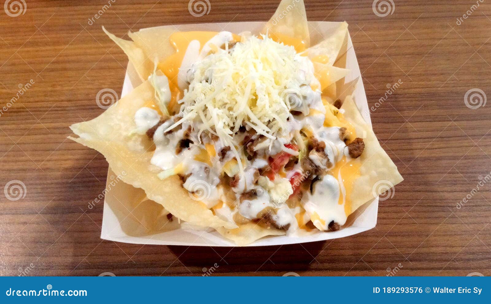 Nacho Taco Chips with Ground Beef, Cheese, Sauce, and Tomatoes Stock